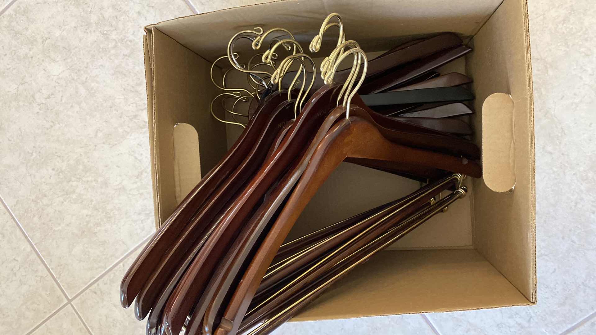 Photo 1 of BOX OF 21 WOODEN HANGERS