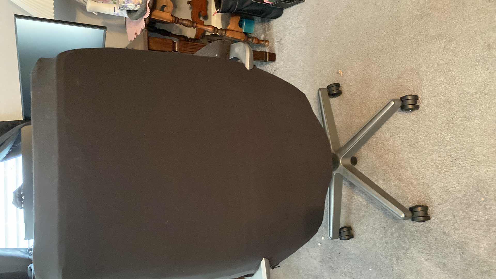 Photo 1 of BLACK DESK CHAIR ON WHEELS