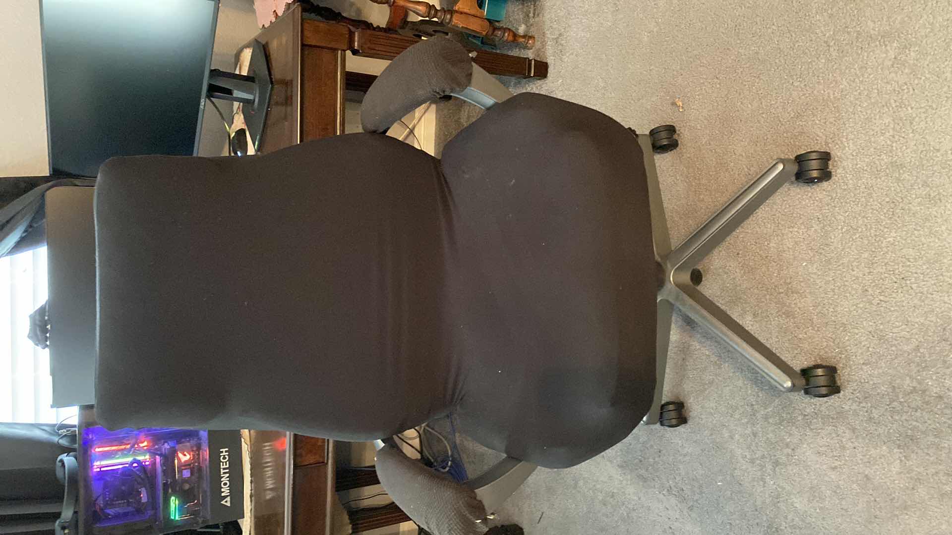Photo 1 of BLACK DESK CHAIR ON WHEELS