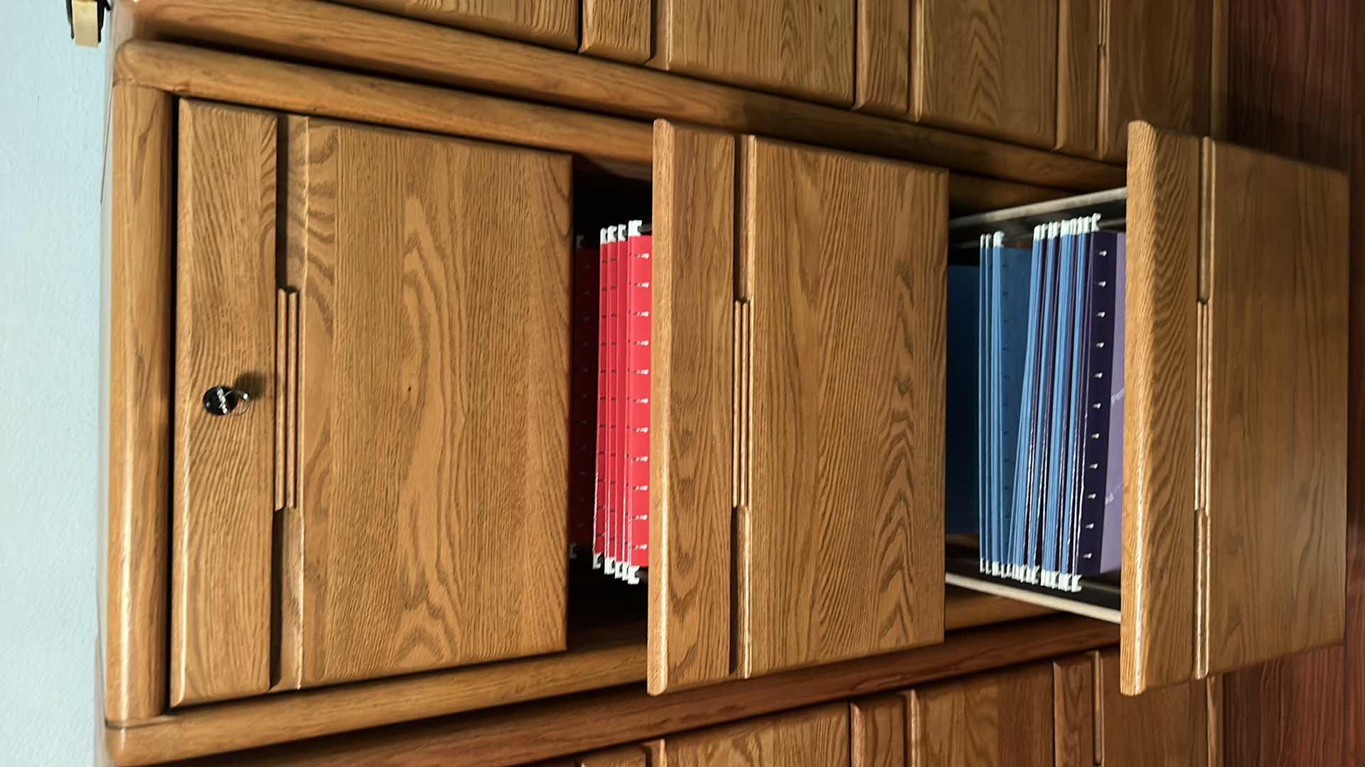 Photo 1 of SOLID WOOD LOCKING FILE CABINET WITH KEY 21” x 25” x H 55” includes file folders