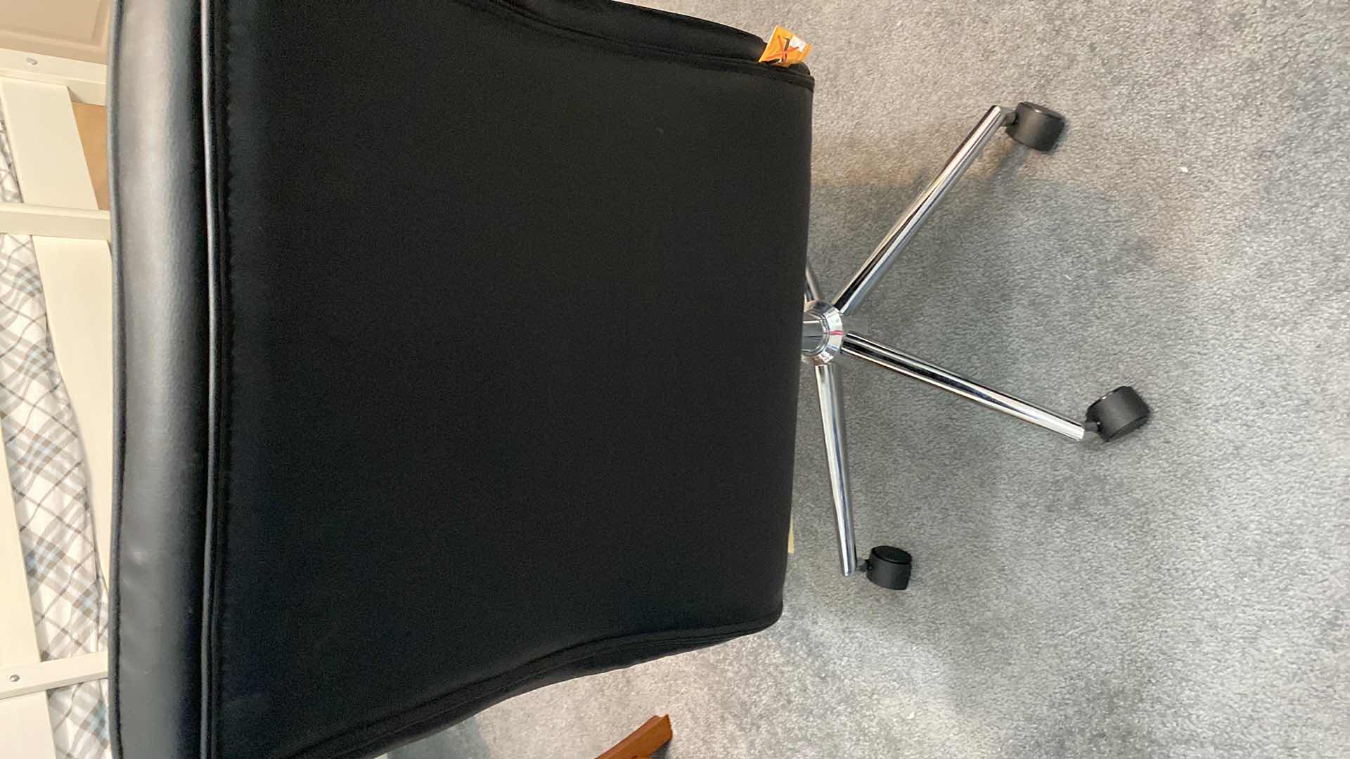 Photo 1 of BLACK FAUX LEATHER ARMLESS DESK ROLLING CHAIR