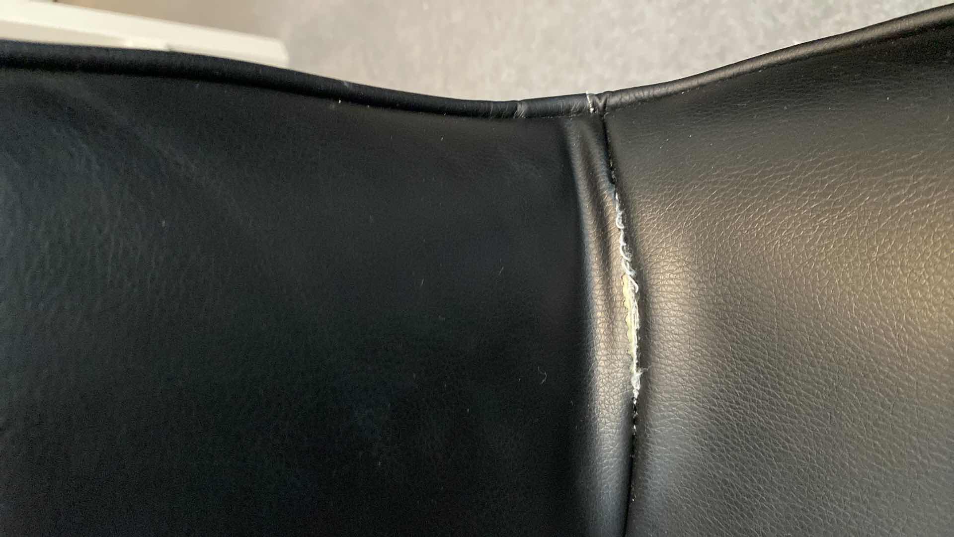 Photo 1 of BLACK FAUX LEATHER ARMLESS DESK ROLLING CHAIR