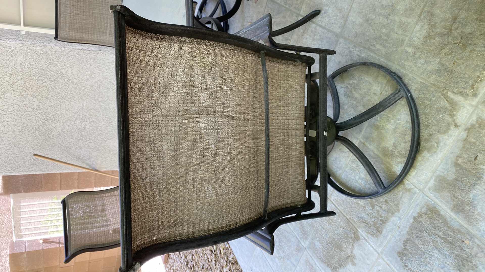 Photo 1 of GLASS AND ALUMINUM PATIO TABLE 54” WITH 4 SWIVEL CHAIRS