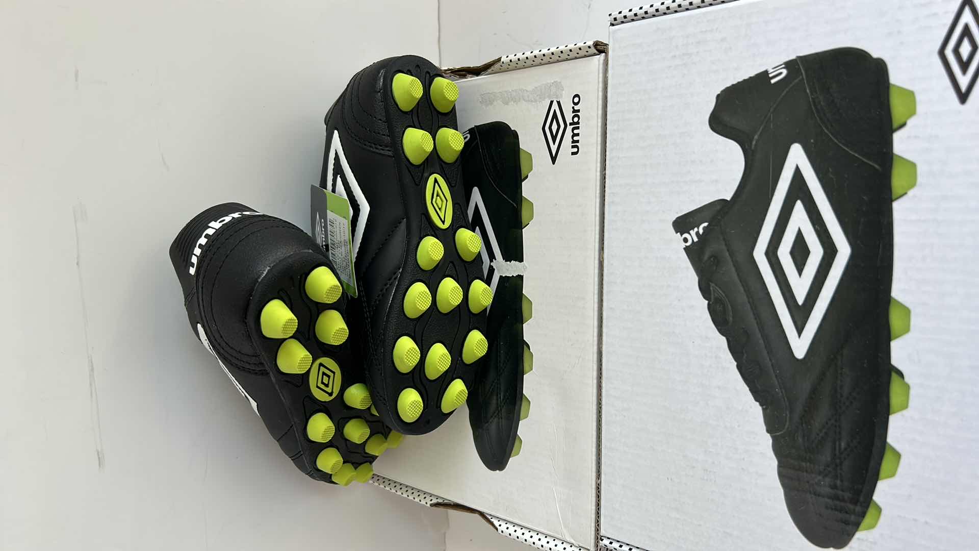 Photo 1 of 2 PAIRS NEW CHILDS SOCCER CLEATS SIZE 12