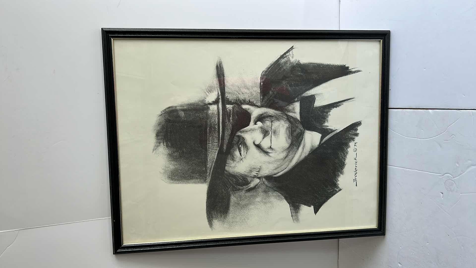 Photo 1 of BLACK FRAMED BLACK AND WHITE JOHN WAYNE ARTWORK BY BRODERICK ‘74 19.5” x 25.5”