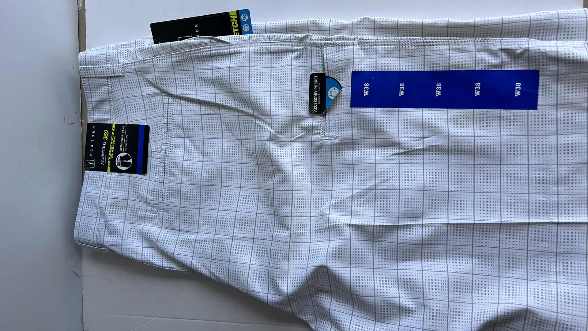 Photo 1 of NEW MEN AND WOMENS GOLF SHORTS AND SKORT