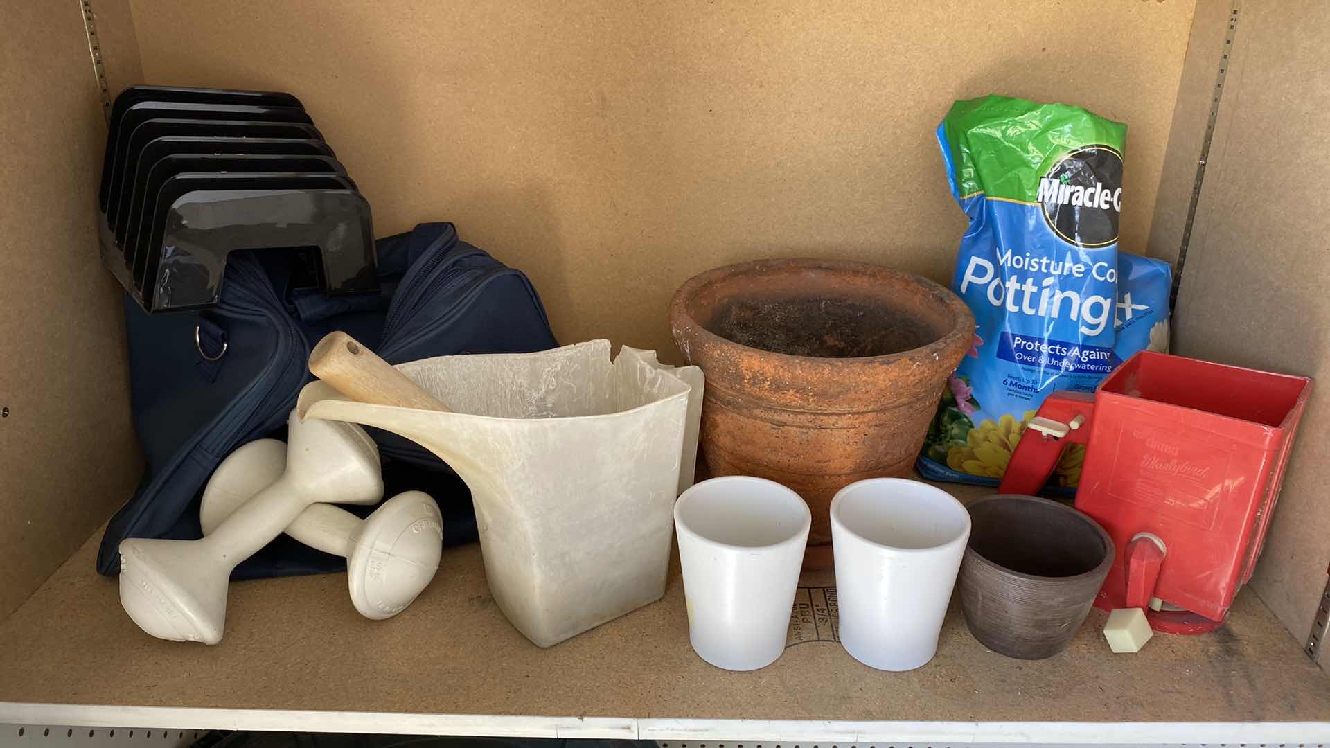 Photo 1 of CONTENTS OF GARAGE CABINET FOOT BATH GARDENING TINS AND MORE