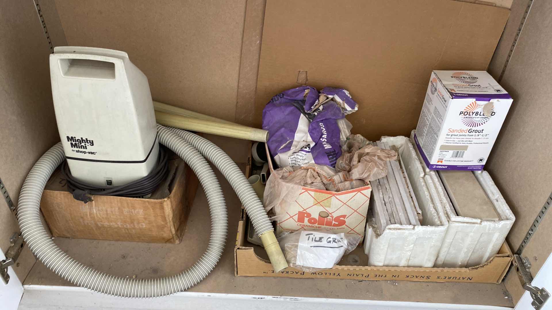 Photo 1 of CONTENTS OF GARAGE CABINET MIGHTY MINI SHOP VAC RAGS TILE AND GROUT