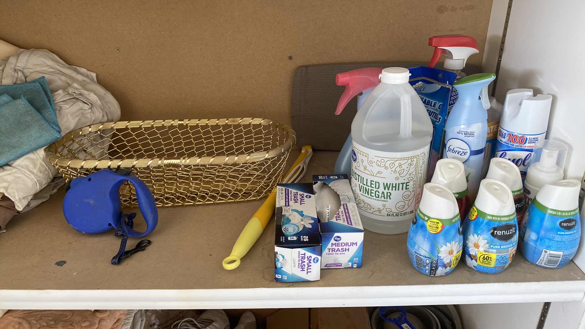 Photo 1 of 2 SHELFS OF GARAGE CABINET HOUSEHOLD ITEMS RAGS BASKET DOG LEASH AND MORE
