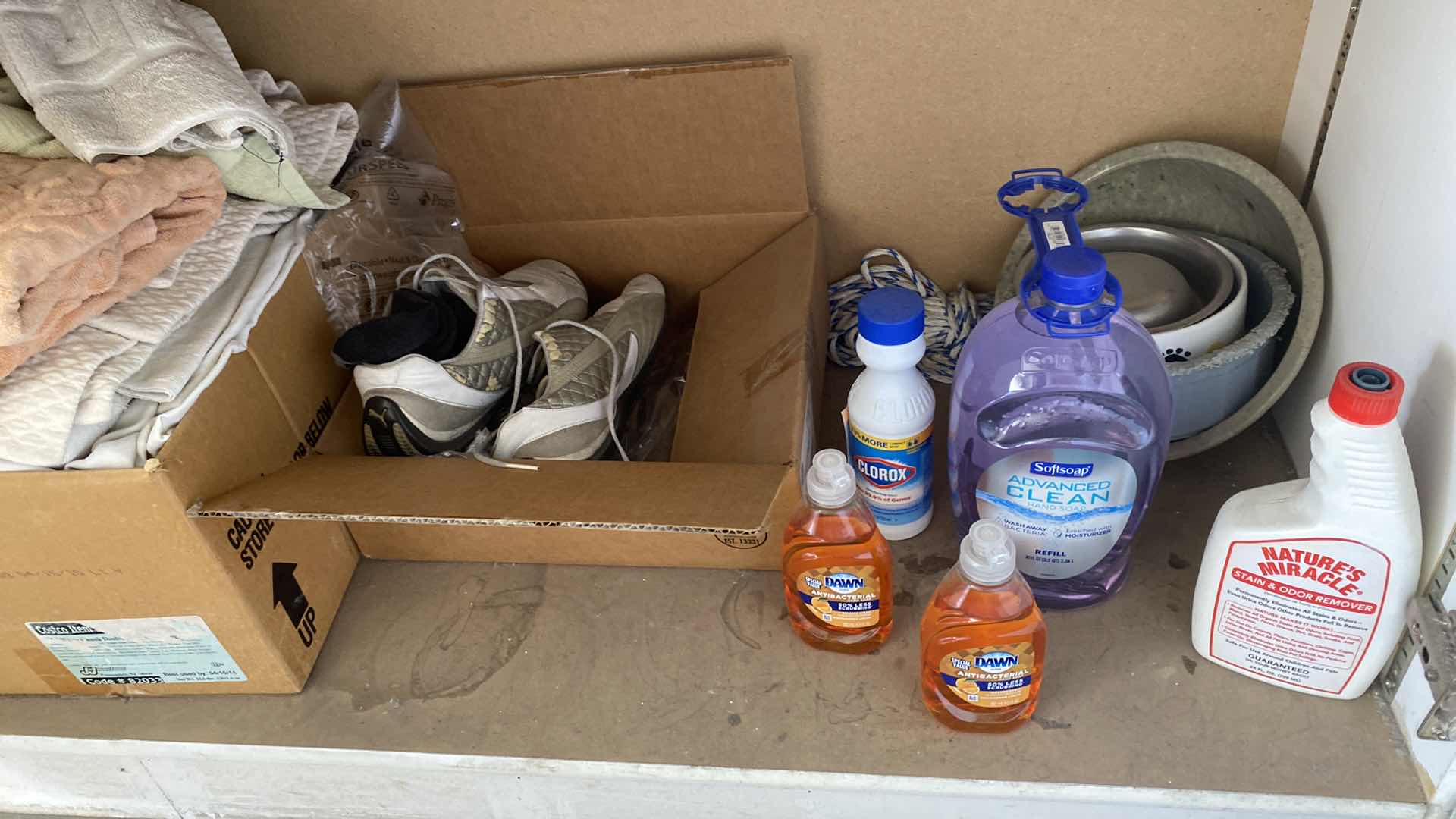 Photo 1 of 2 SHELFS OF GARAGE CABINET HOUSEHOLD ITEMS RAGS BASKET DOG LEASH AND MORE