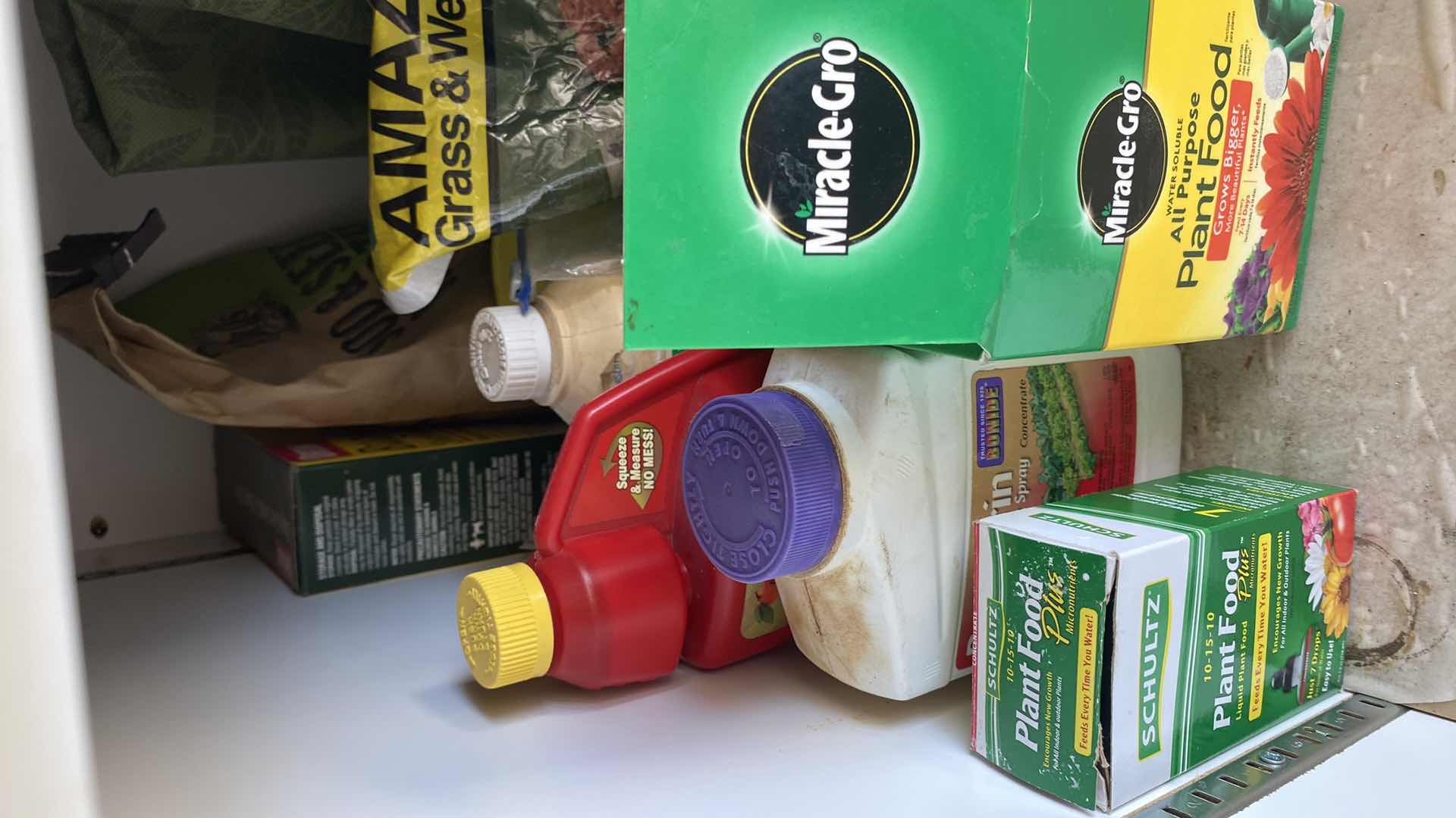 Photo 1 of CONTENTS OF GARAGE CABINET AND DRAWER GARDENING SUPPLIES AND MORE