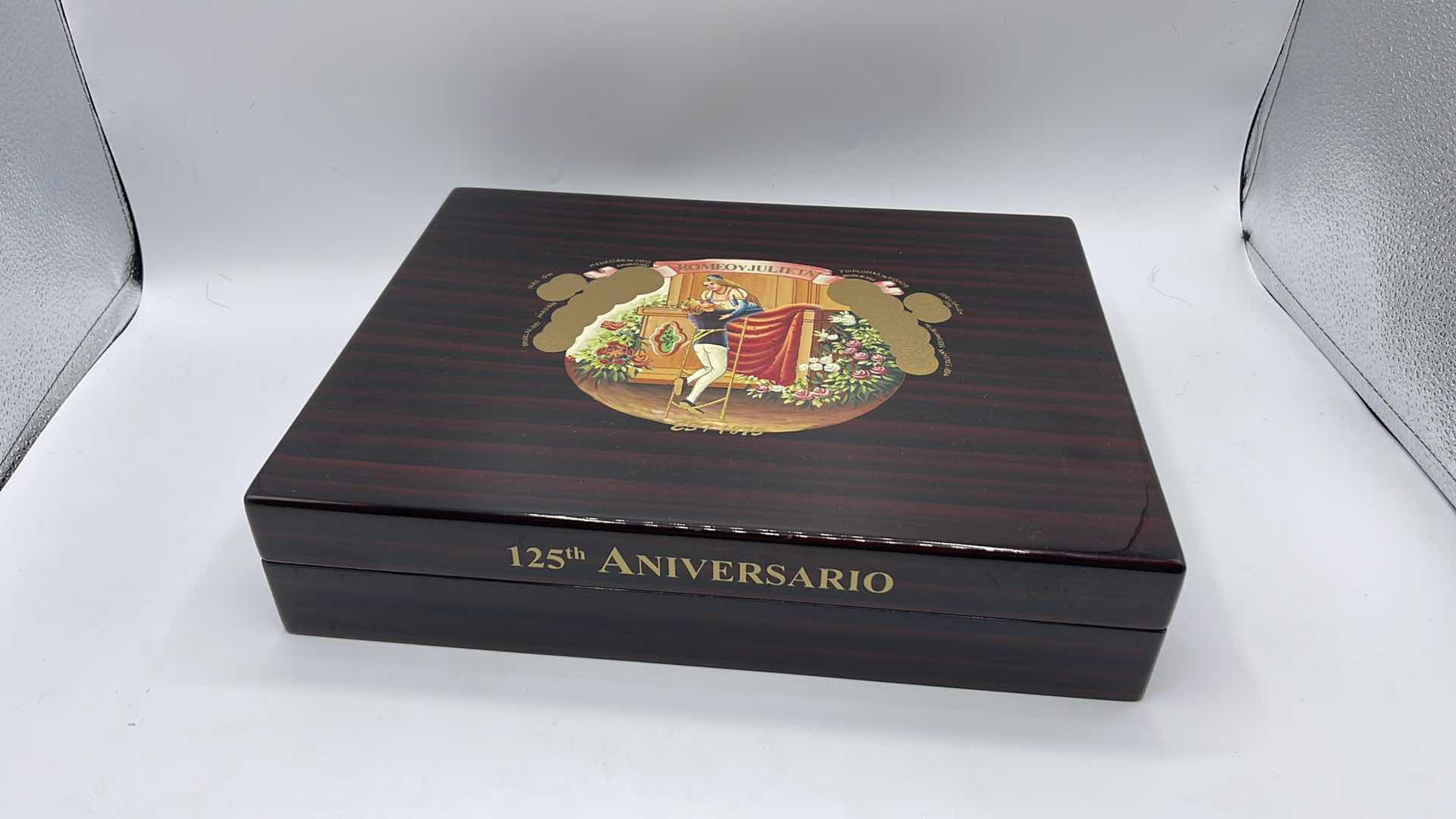 Photo 1 of VINTAGE LACQUERED WOODEN CIGAR HUMIDOR 125th ANNIVERSARY ROMEO AND JULIET 12” X 10” H 2.5”