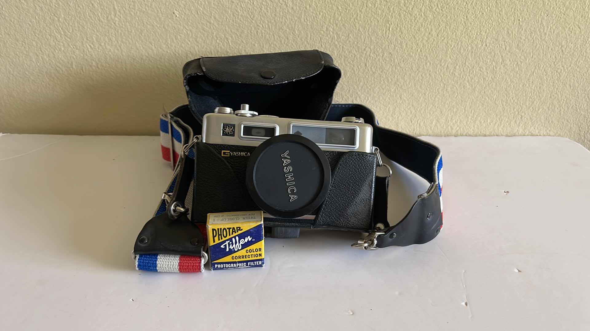Photo 1 of YASHICA ELECTRO 35 GSN 35mm CAMERA W/CASE AND FILTER