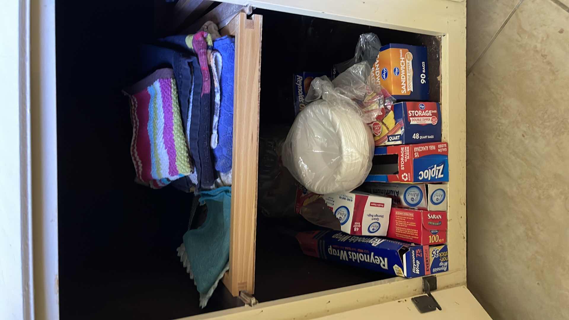 Photo 1 of CONTENTS OF CUPBOARD, DISHTOWELS, PLASTIC STORAGE BAGS