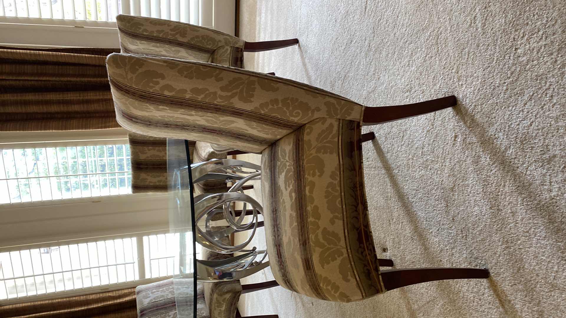 Photo 1 of ROUND BEVELED EDGE GLASS TABLE WITH SILVER METAL BASE AND 5 CHAIRS 54” H29” AND TABLE PROTECTOR