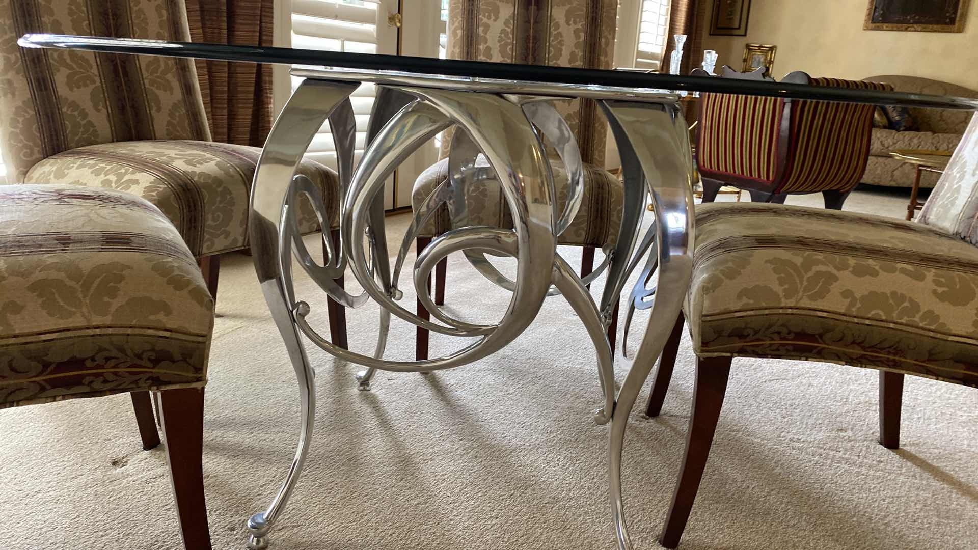 Photo 1 of ROUND BEVELED EDGE GLASS TABLE WITH SILVER METAL BASE AND 5 CHAIRS 54” H29” AND TABLE PROTECTOR