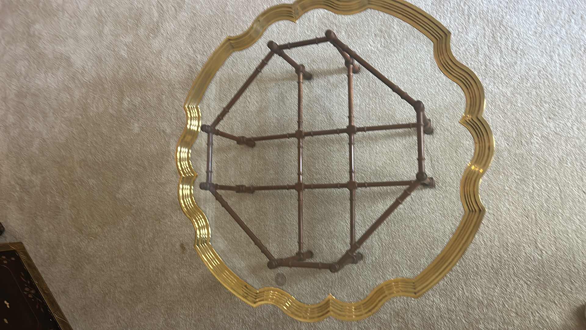 Photo 1 of UNIQUE SCALLOPED ROUND COFFEE TABLE WITH GOLD TRIM ON WOOD STAND 43” x 16”