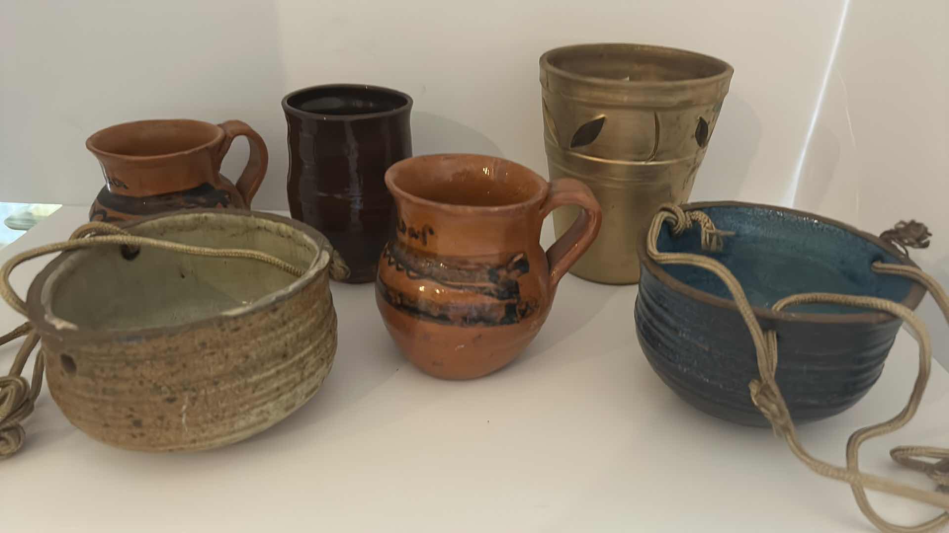 Photo 1 of POTTERY AND STONEWARE ASSORTMENT WITH TWO HANGING POTS 4” x 3”