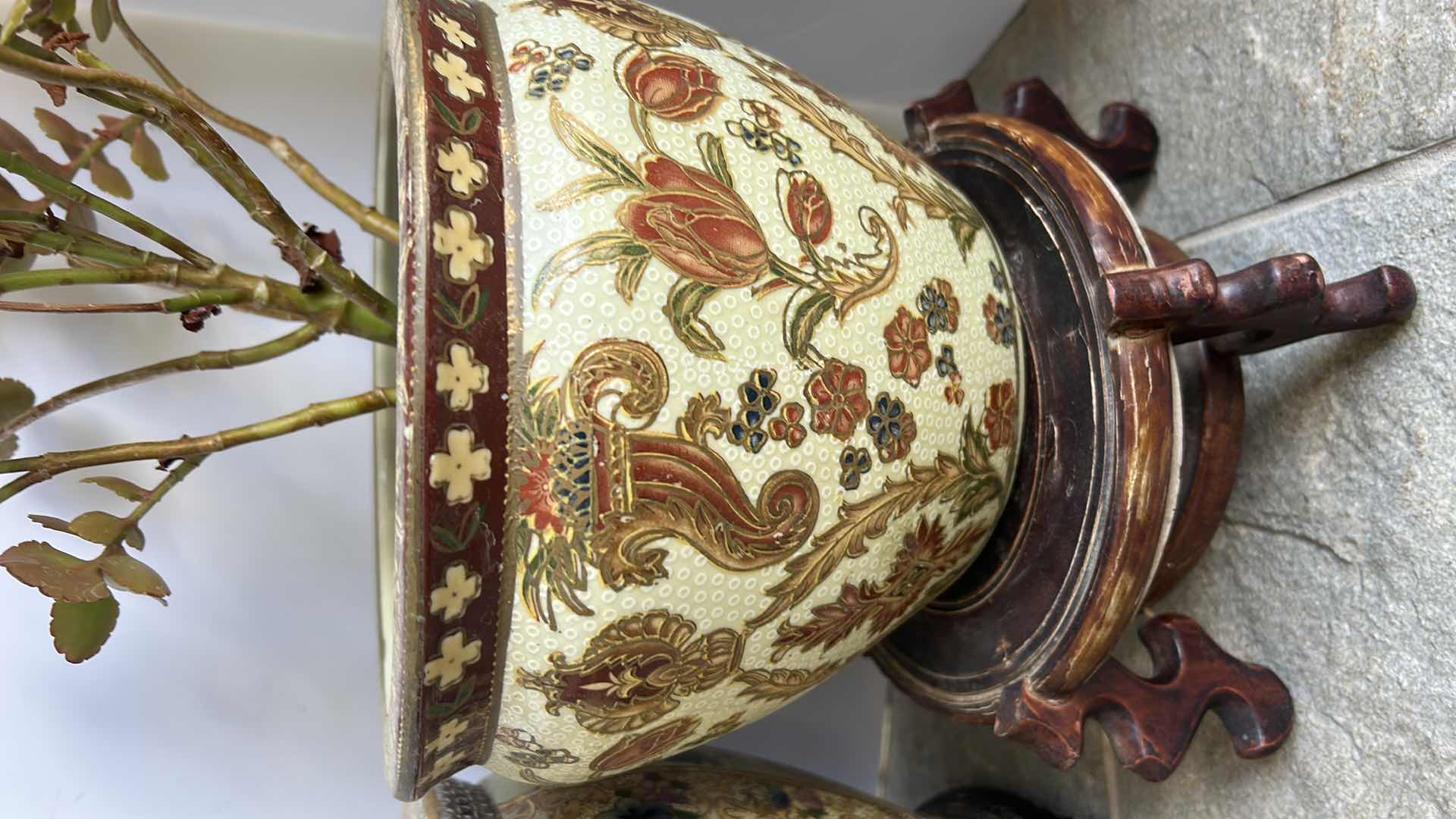 Photo 1 of TWO LIVE PLANTS IN PORCELAIN POTTERY W STANDS TALLEST H8”