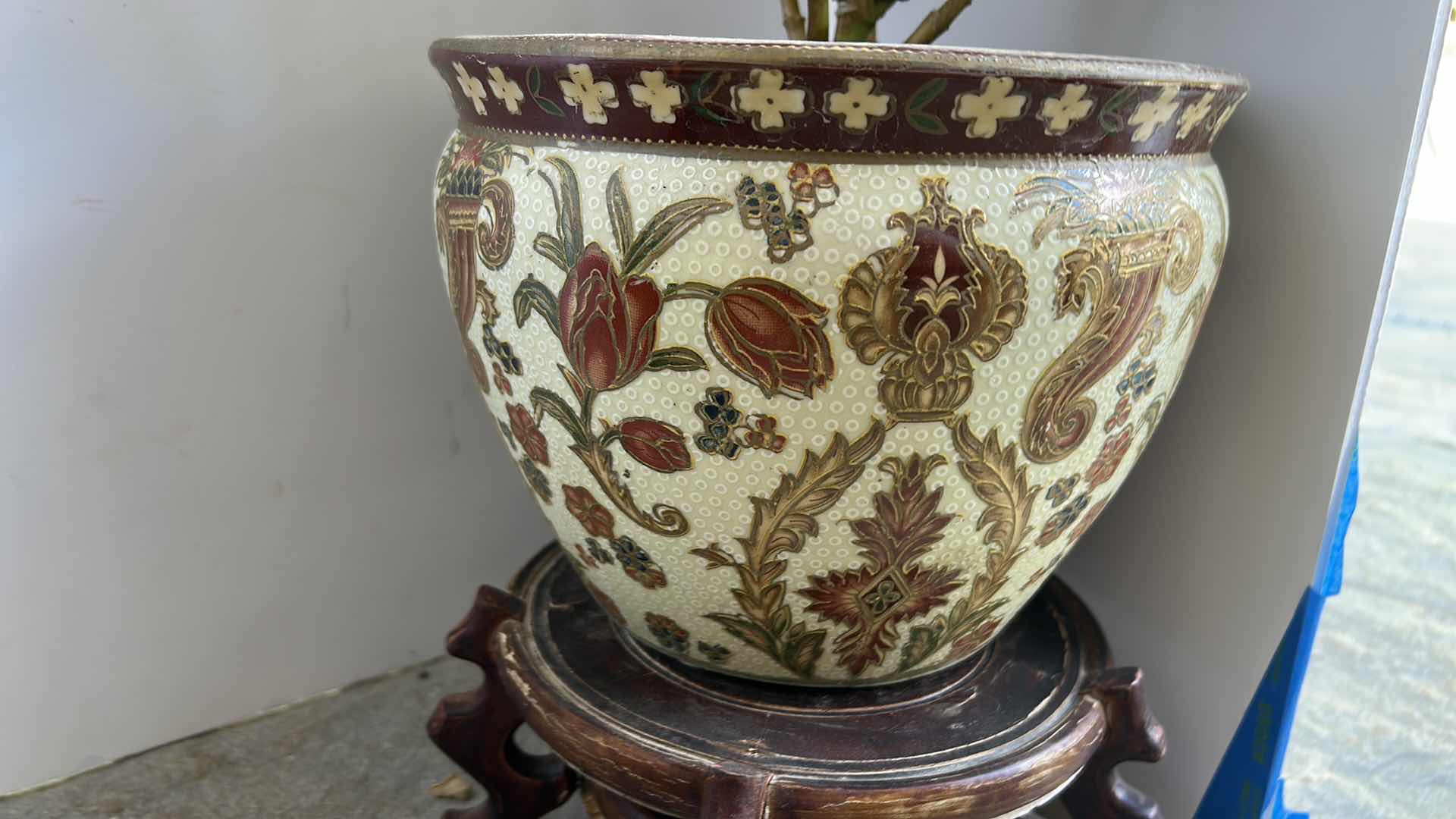 Photo 1 of TWO LIVE PLANTS IN PORCELAIN POTTERY W STANDS TALLEST H8”