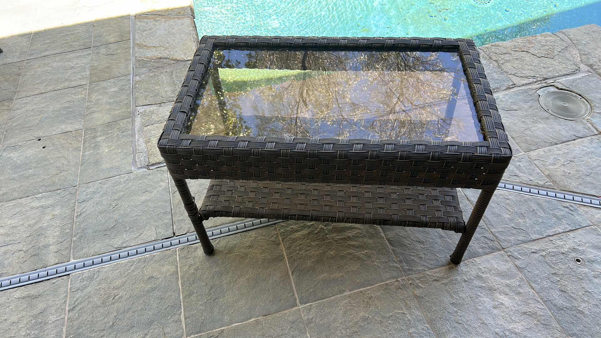 Photo 1 of STYLEWELL FAUX WICKER AND GLASS OUTDOOR COFFEE TABLE 30” x 18”