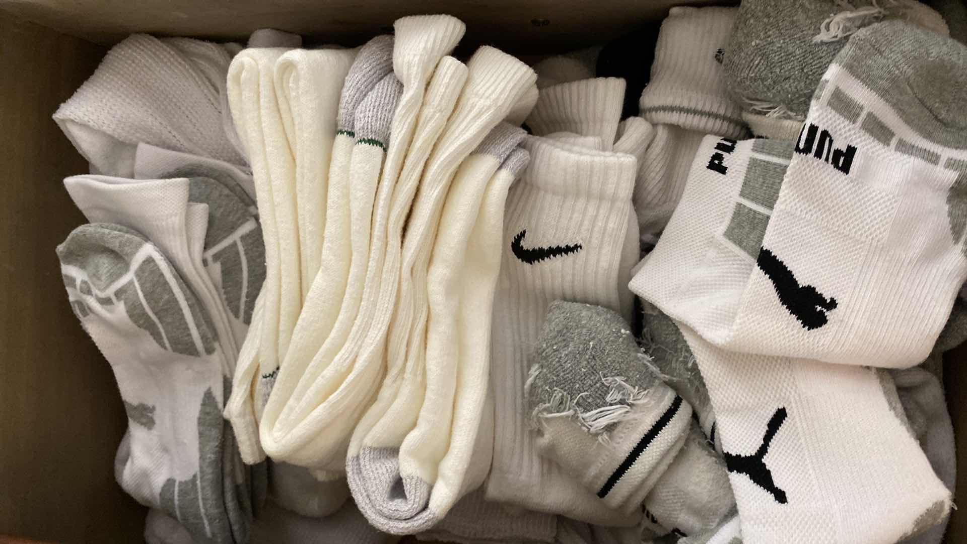 Photo 1 of CONTENTS OF 4 DRAWERS OF MENS SOCKS