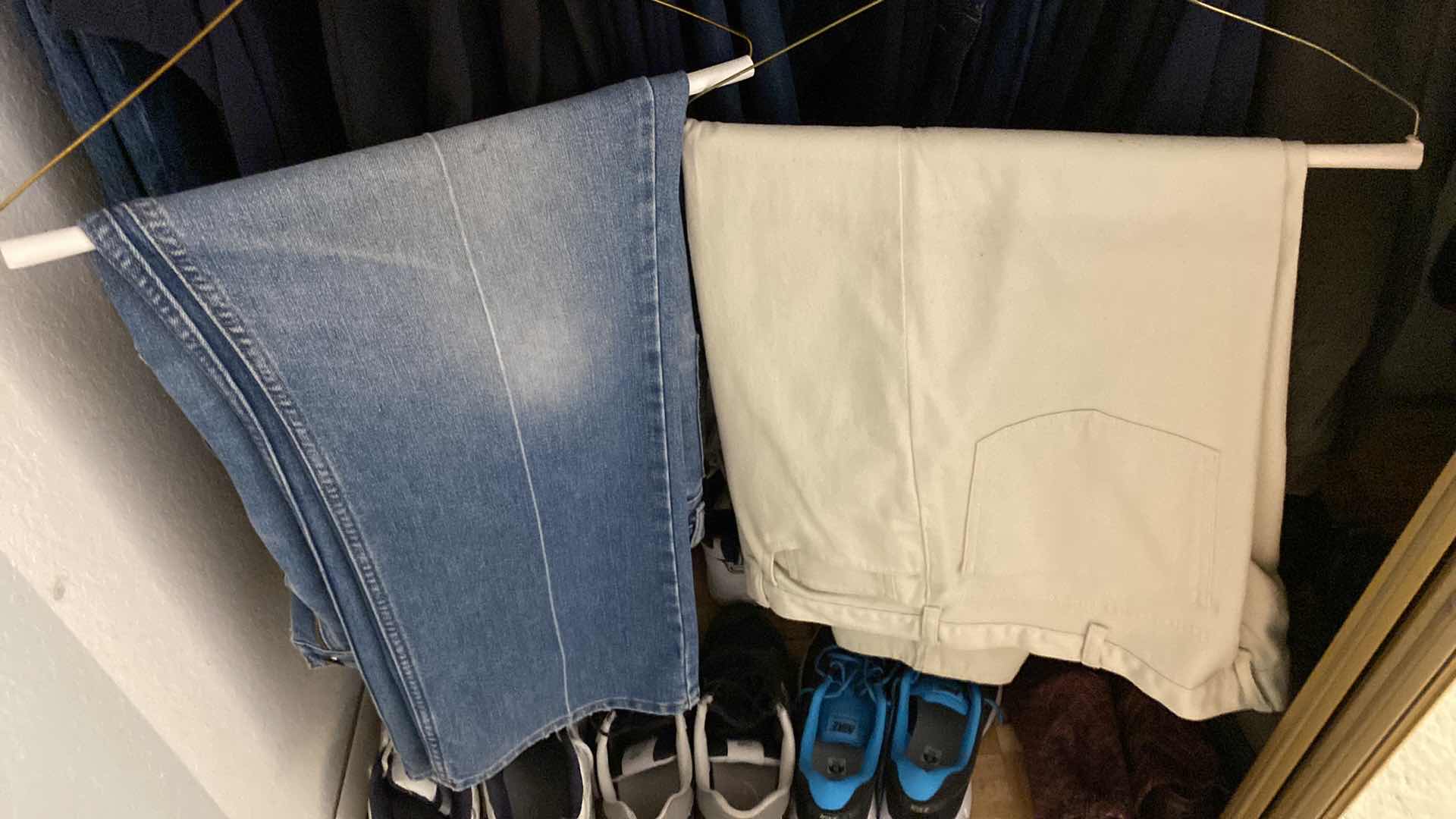 Photo 1 of LEFT LOWER SIDE OF CLOSET MENS SWEAT PANTS AND JEANS SIZE LARGE 40 AND 42