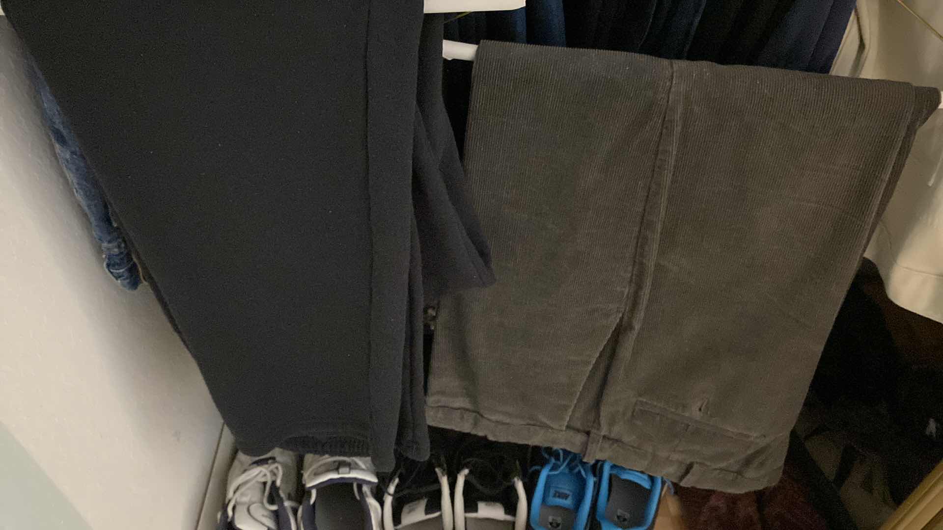 Photo 1 of LEFT LOWER SIDE OF CLOSET MENS SWEAT PANTS AND JEANS SIZE LARGE 40 AND 42