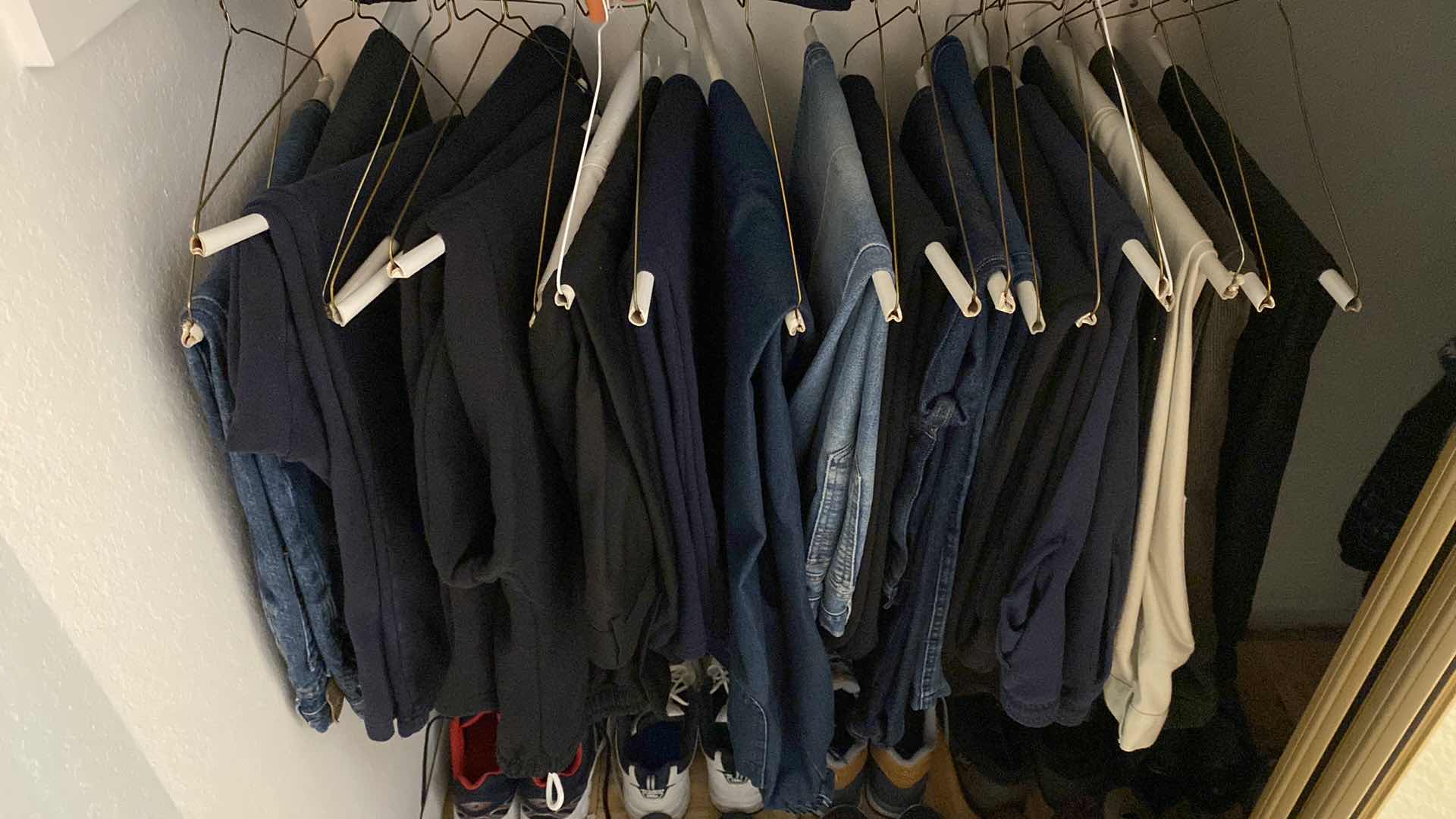 Photo 1 of LEFT LOWER SIDE OF CLOSET MENS SWEAT PANTS AND JEANS SIZE LARGE 40 AND 42