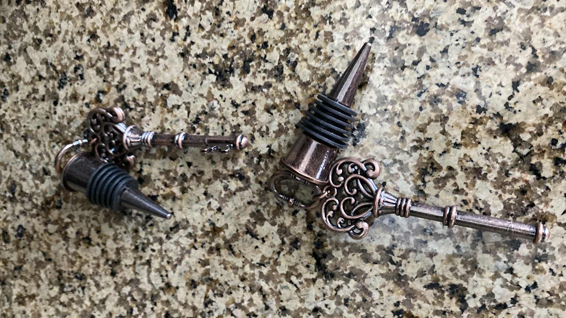 Photo 1 of ELECTRIC TABLE WINE OPENER AND PAIR OF WINE STOPPERS