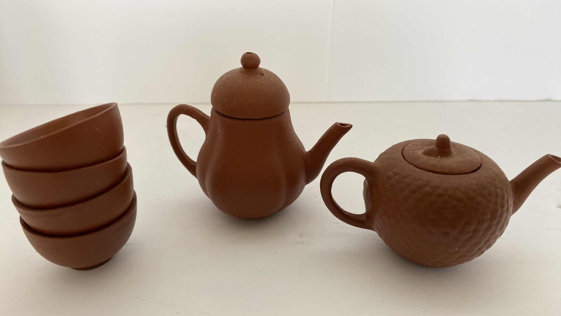 Photo 1 of PAIR OF VINTAGE CHINESE COLLECTIBLE CLAY TEA POTS WITH 4 TEA CUPS LARGEST TEAPOT 3” x 2”