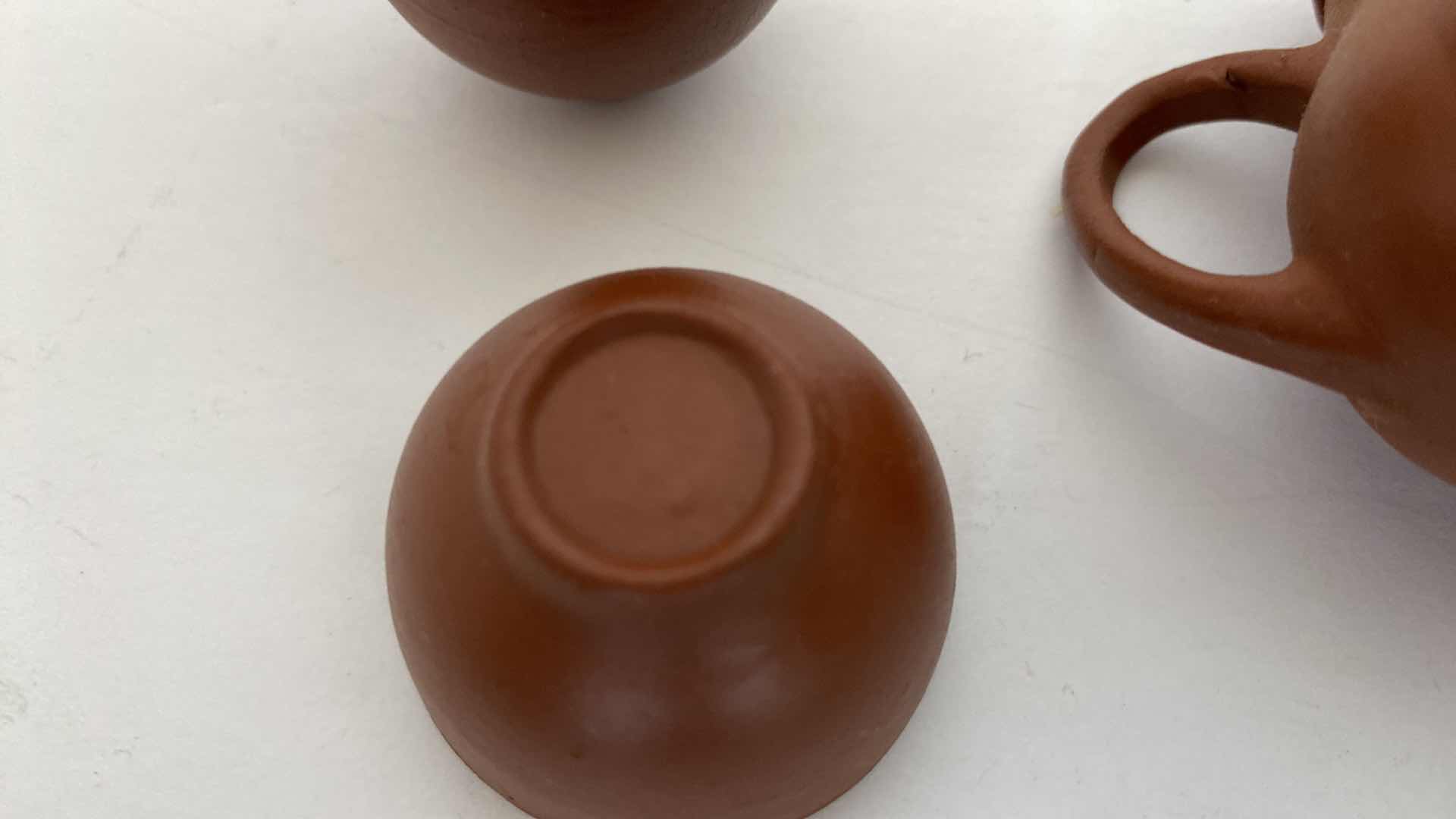 Photo 1 of PAIR OF VINTAGE CHINESE COLLECTIBLE CLAY TEA POTS WITH 4 TEA CUPS LARGEST TEAPOT 3” x 2”