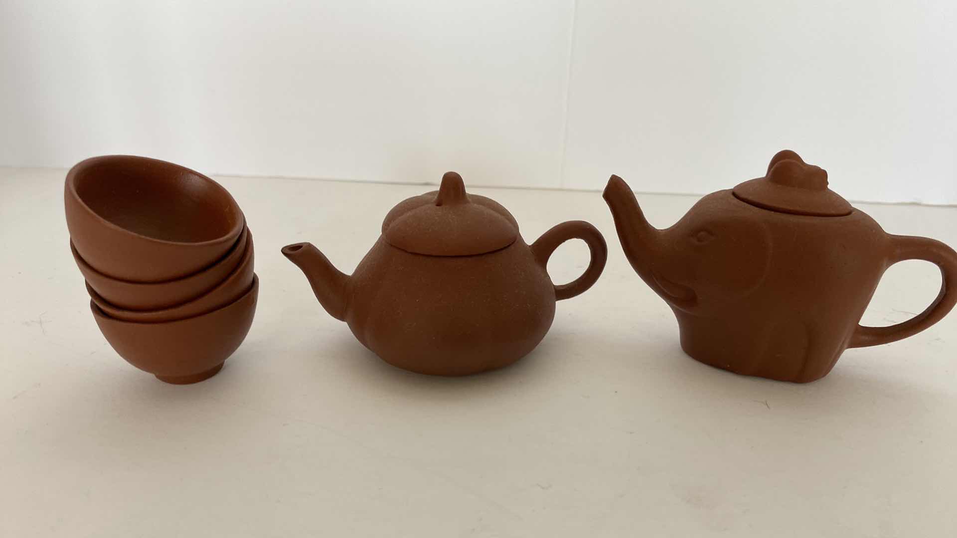 Photo 1 of PAIR OF VINTAGE CHINESE COLLECTIBLE CLAY TEA POTS WITH 4 TEA CUPS LARGEST TEAPOT 3.25“ x 2“