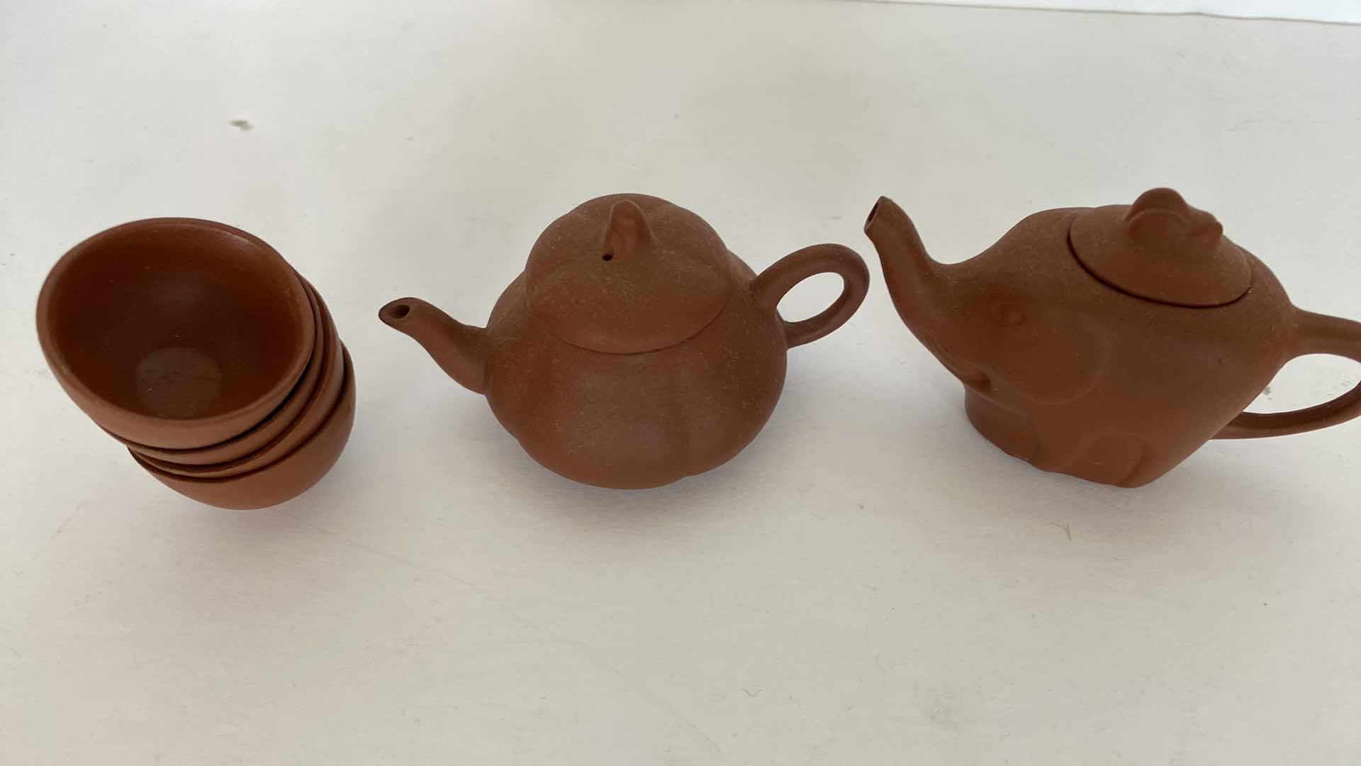 Photo 1 of PAIR OF VINTAGE CHINESE COLLECTIBLE CLAY TEA POTS WITH 4 TEA CUPS LARGEST TEAPOT 3.25“ x 2“