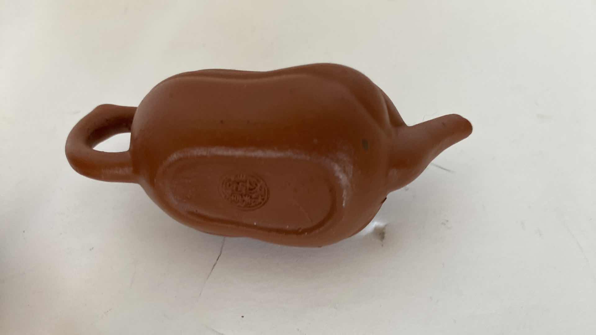 Photo 1 of PAIR OF VINTAGE CHINESE COLLECTIBLE CLAY TEA POTS WITH 4 TEA CUPS LARGEST TEAPOT 3” x 1 7/8”