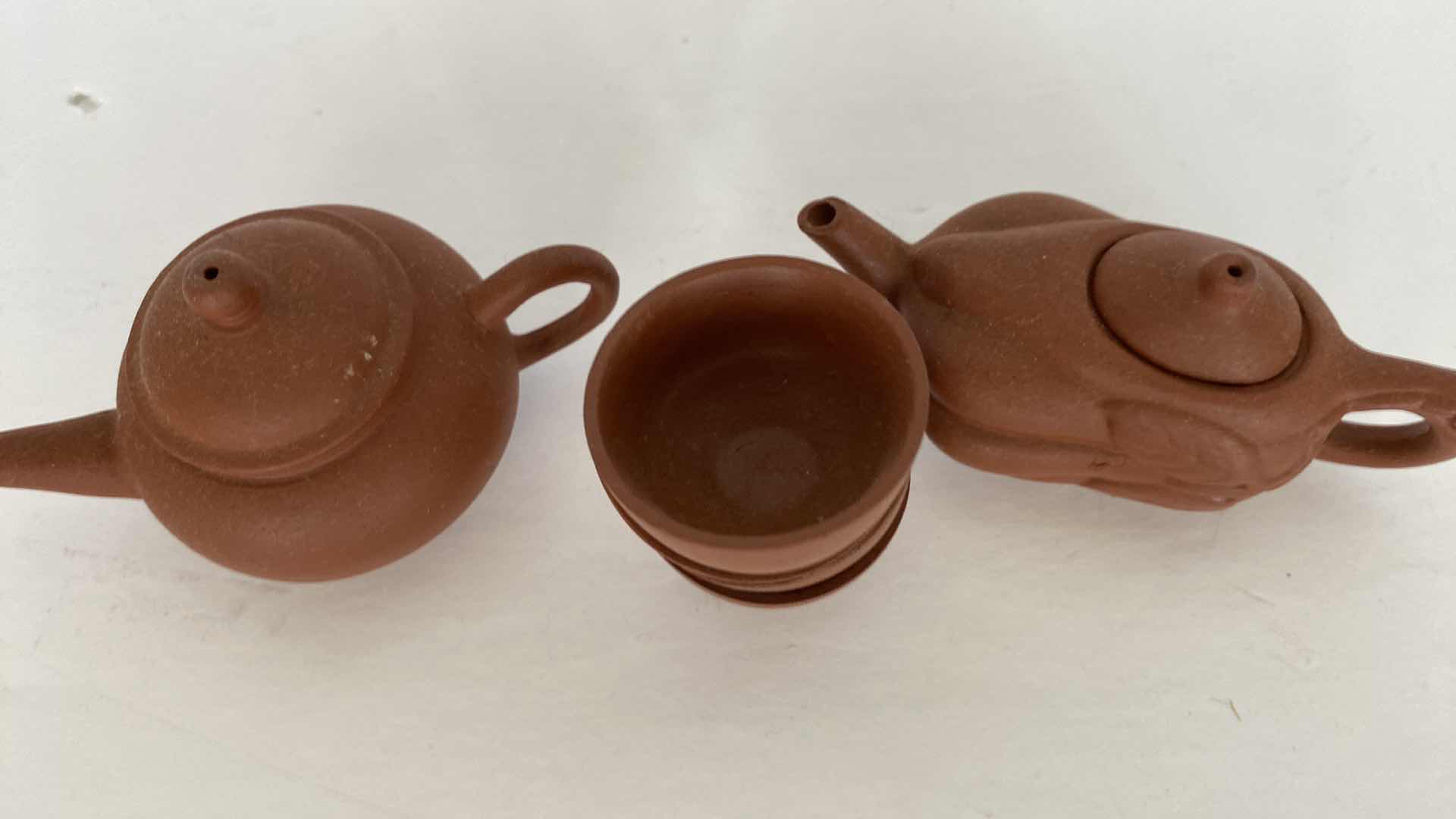 Photo 1 of PAIR OF VINTAGE CHINESE COLLECTIBLE CLAY TEA POTS WITH 4 TEA CUPS LARGEST TEAPOT 3” x 1 7/8”