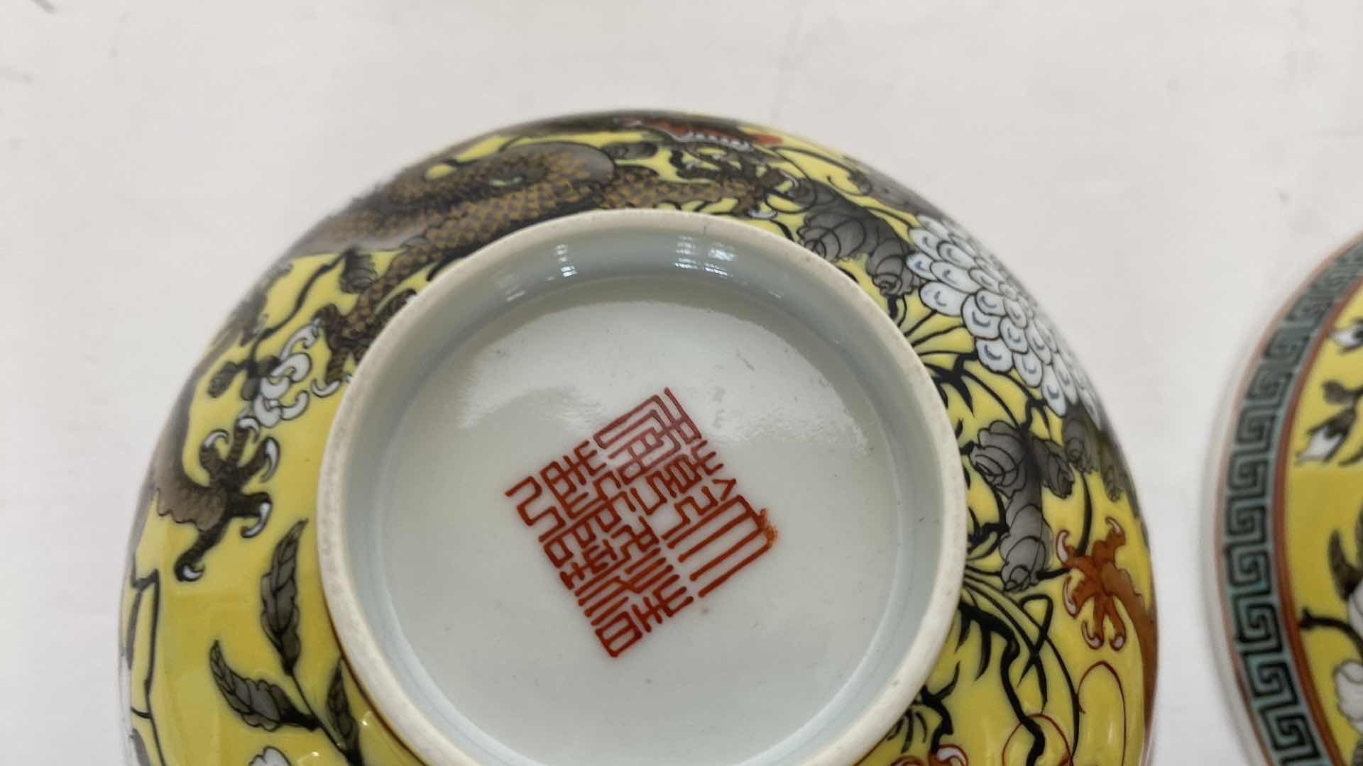 Photo 1 of CHINESE YELLOW GROUND FAMILLE ROSE PAIR OF DRAGON BOWLS 5” AND PAIR OF PLATES 5.375” SEE REIN MARK