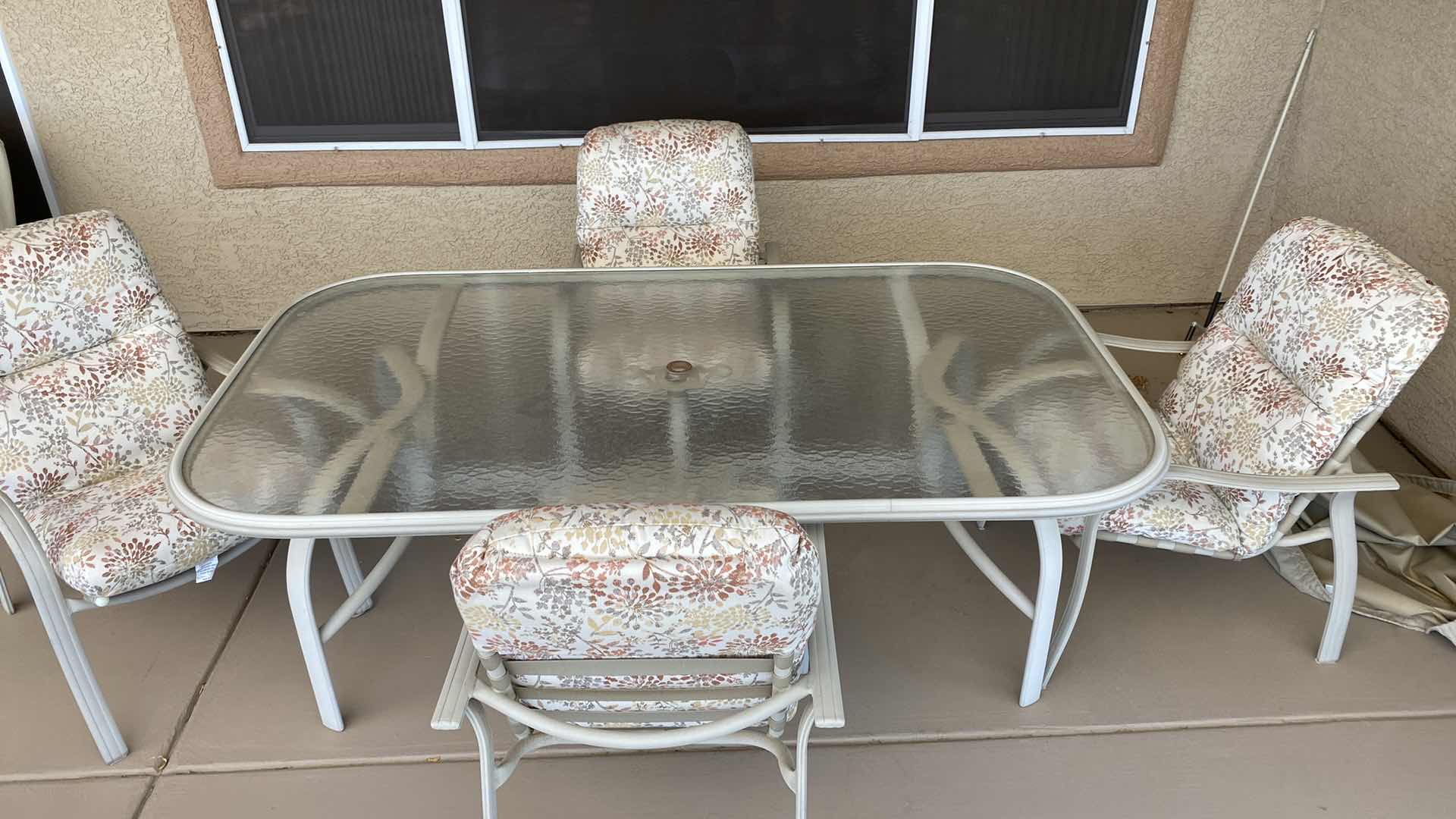 Photo 1 of ALUMINUM TABLE WITH GLASS TOP 78“ x 43“ x 27“ high AND 4 CHAIRS WITH COVERS