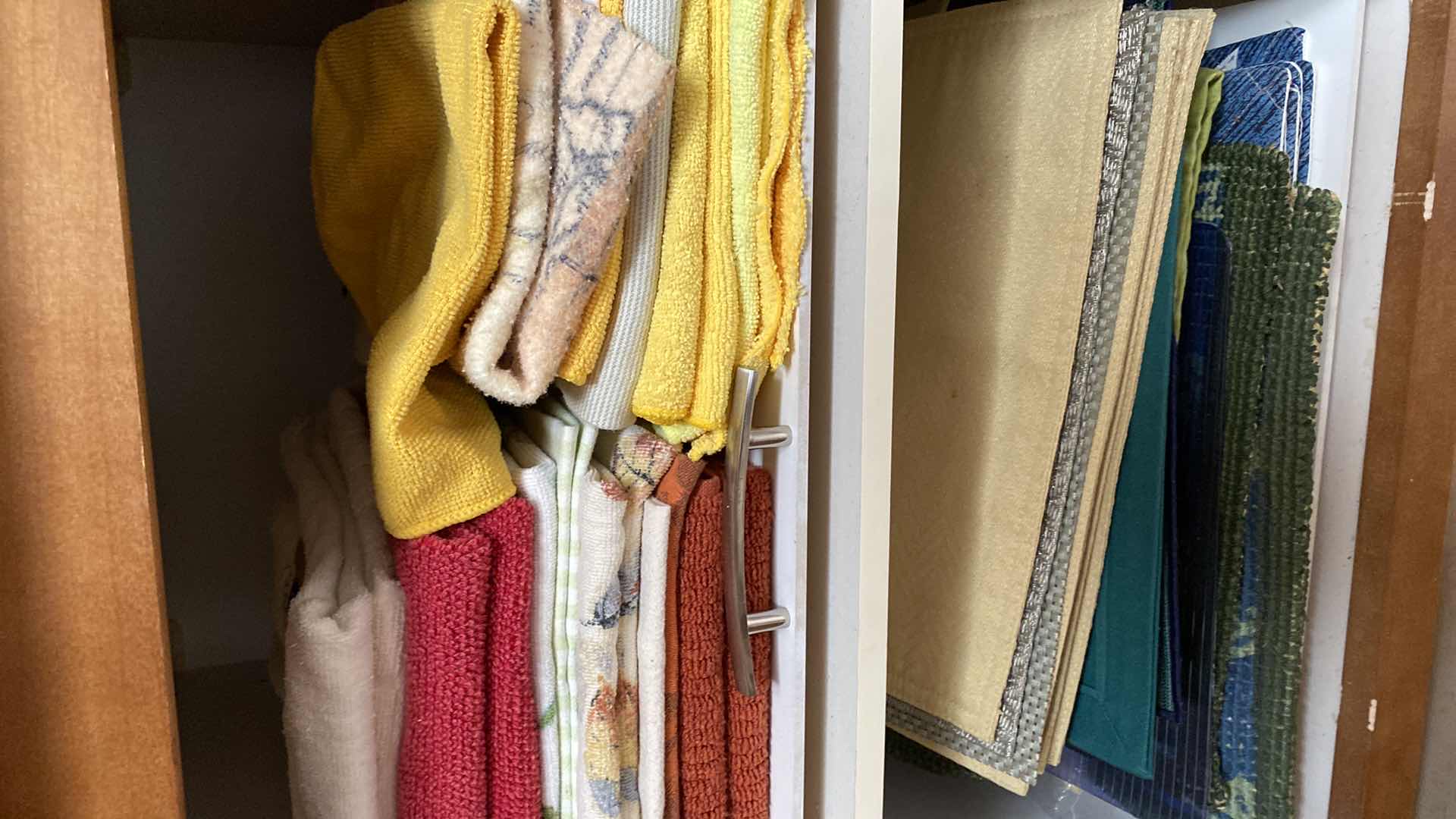 Photo 1 of CONTENTS OF CABINET PLACEMATS AND TOWELS