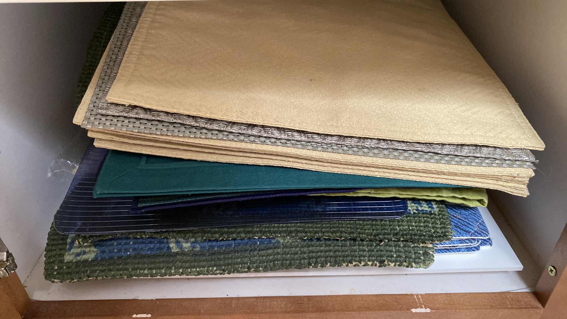 Photo 1 of CONTENTS OF CABINET PLACEMATS AND TOWELS