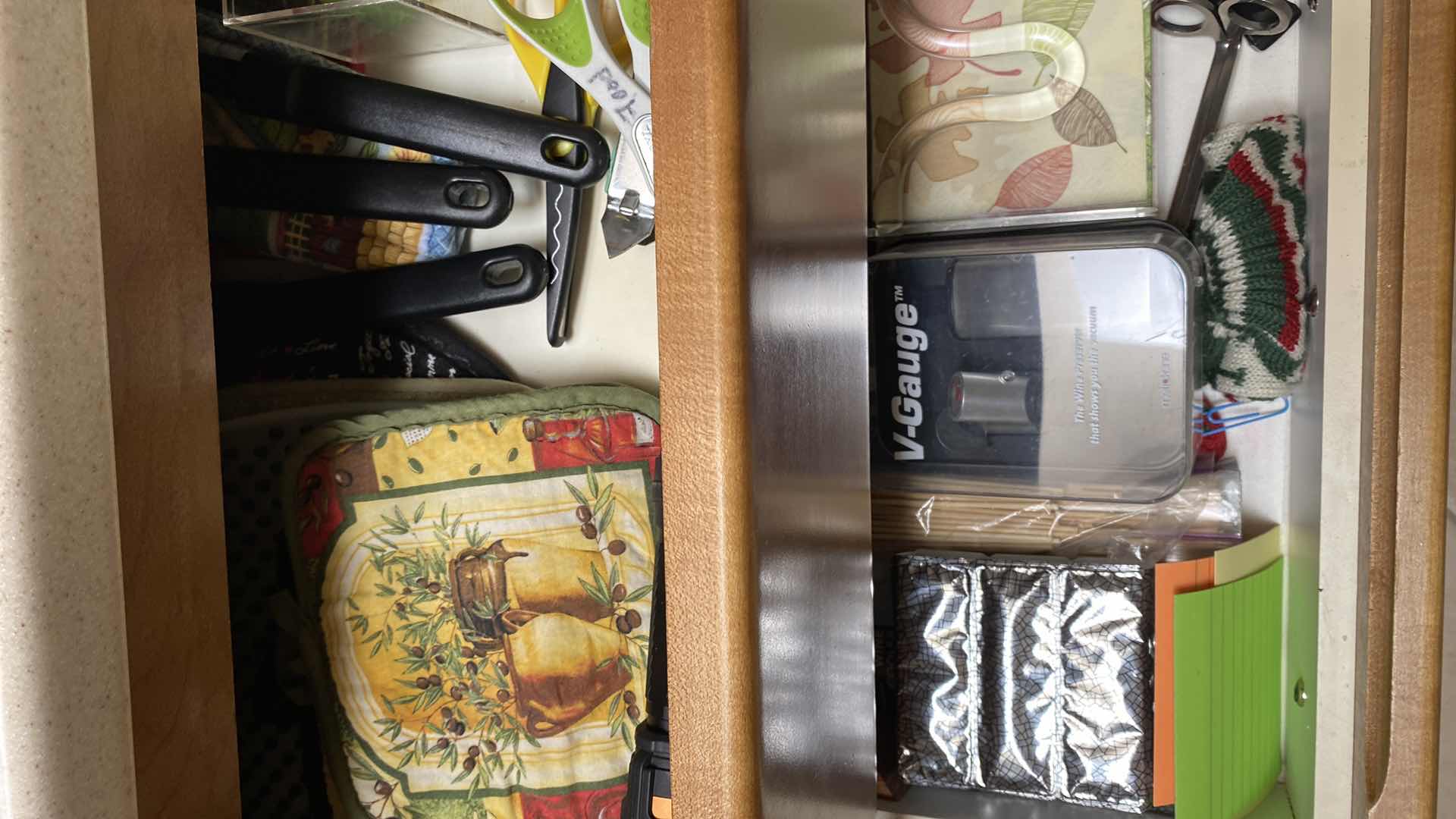 Photo 1 of CONTENTS OF 4 DRAWERS POT HOLDERS UTENSILS AND MORE