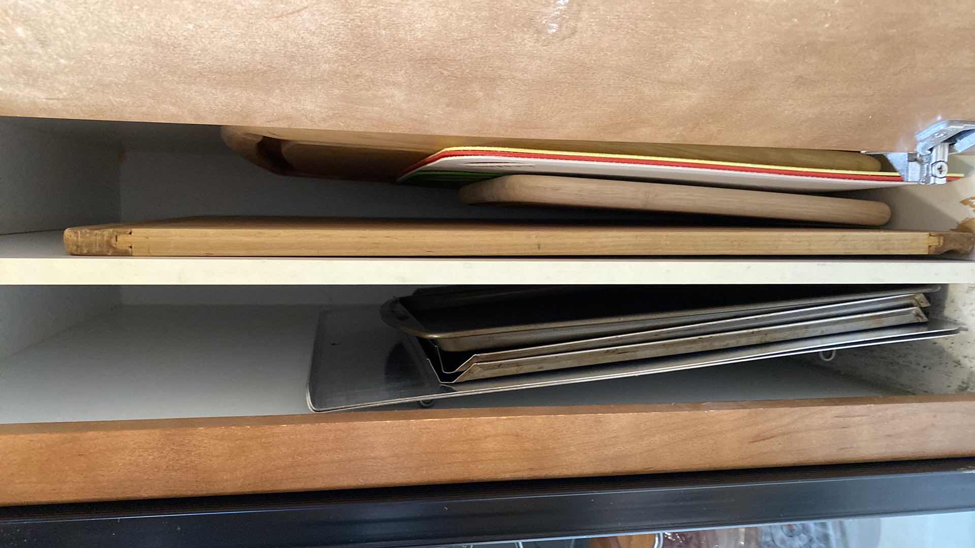 Photo 1 of CONTENTS OF CABINET BAKEWARE AND CUTTING BOARDS