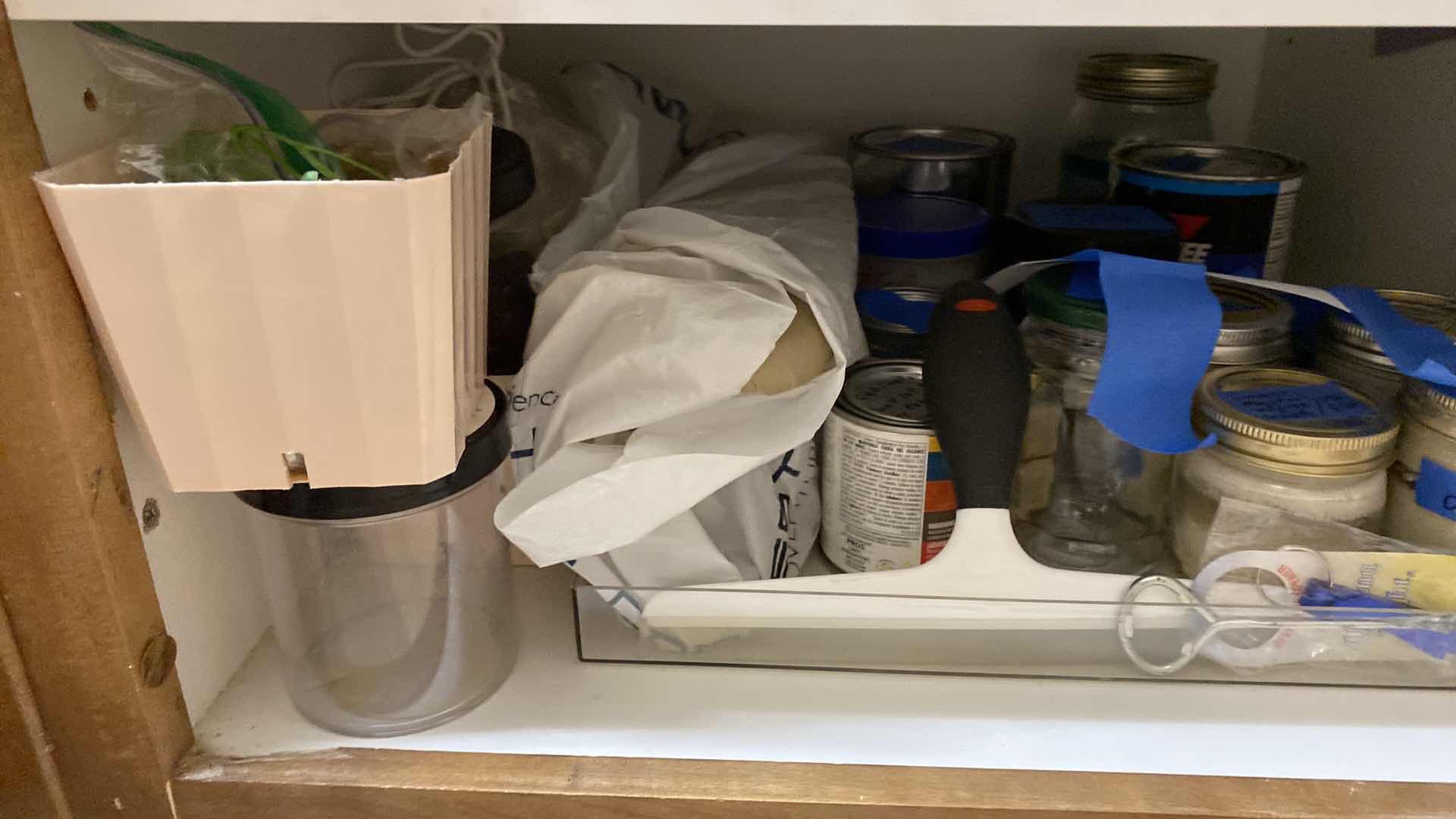 Photo 1 of CONTENTS OF CABINET LAUNDRY ROOM CABINET AND CLOTHES DRYING RACK STEP STOOL AND PLASTIC CONTAINERS