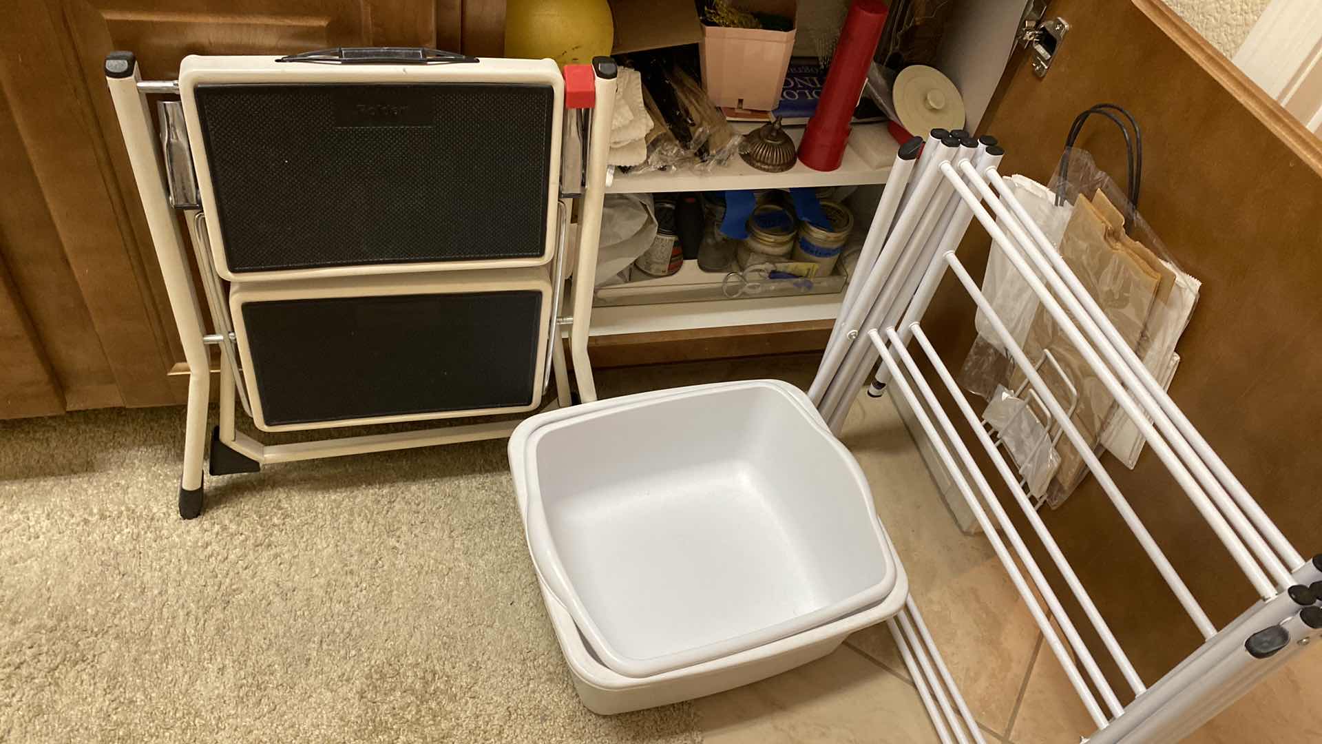 Photo 5 of CONTENTS OF CABINET LAUNDRY ROOM CABINET AND CLOTHES DRYING RACK STEP STOOL AND PLASTIC CONTAINERS
