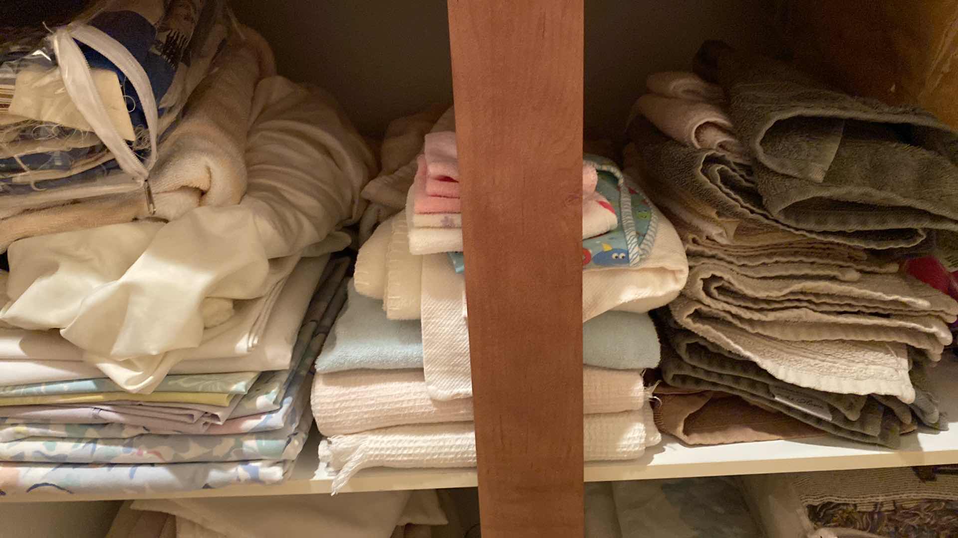 View 4 of Contents of 2 cabinets, quilts towels, linens