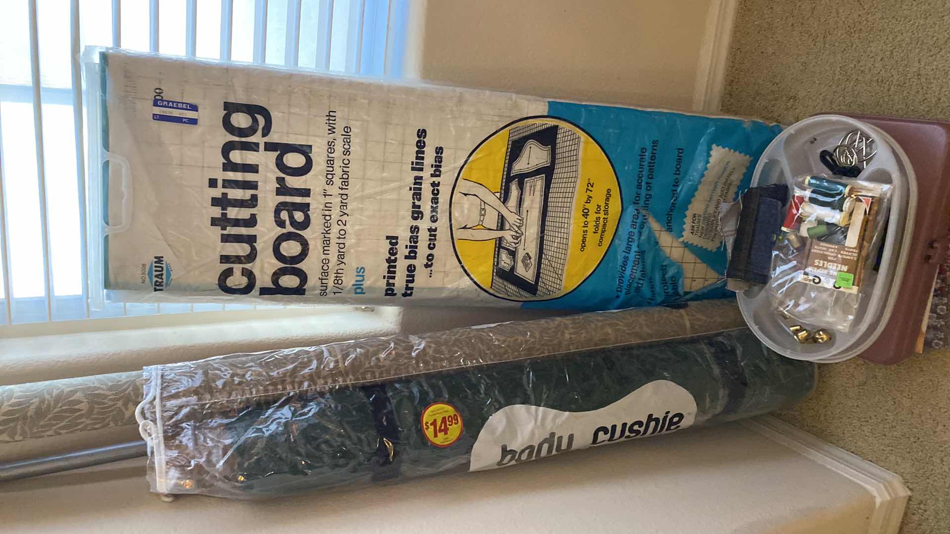 Photo 1 of Cutting board fabric thread, and craft books