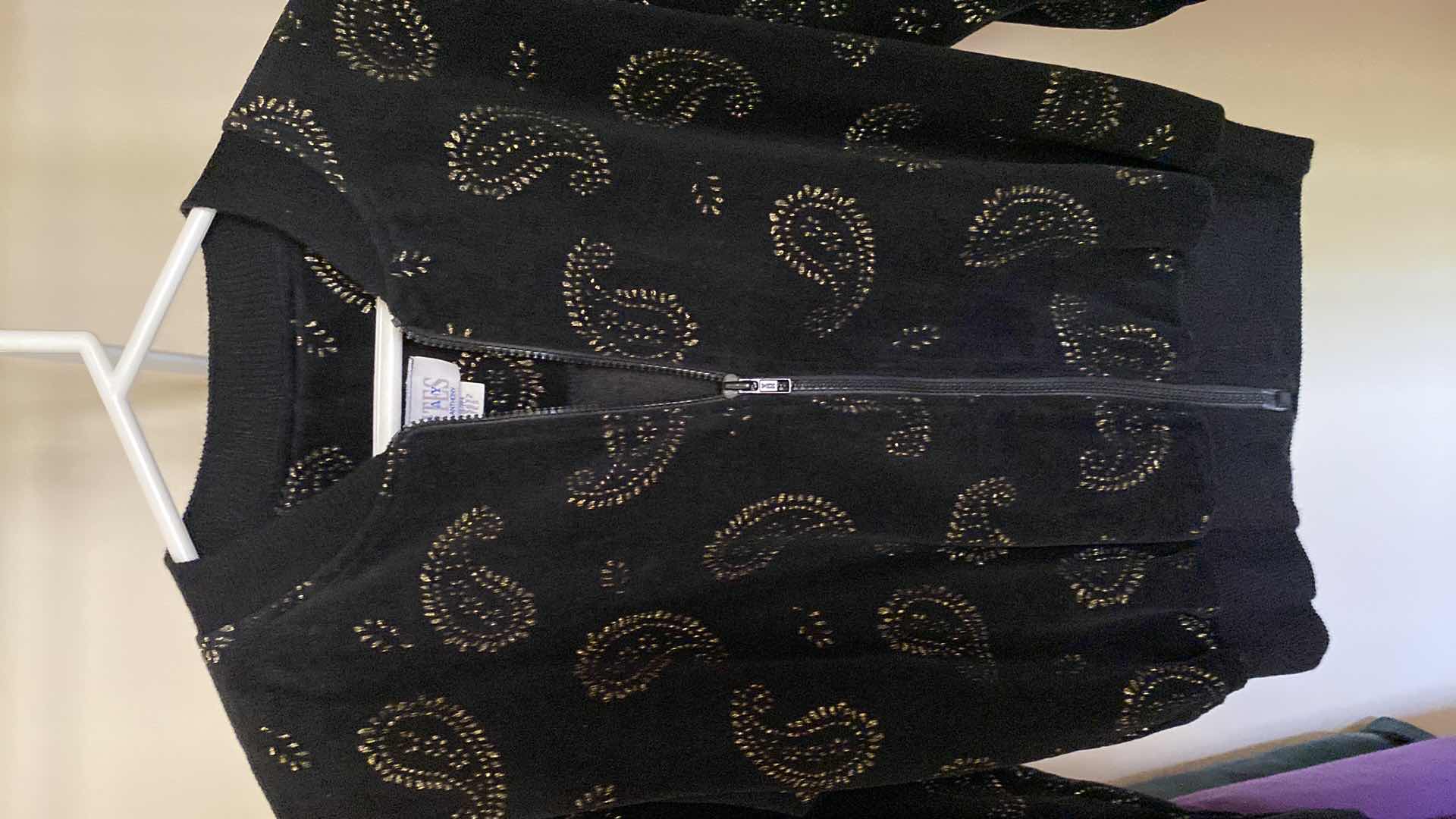 Photo 1 of 4 -  women’s clothing size large and medium