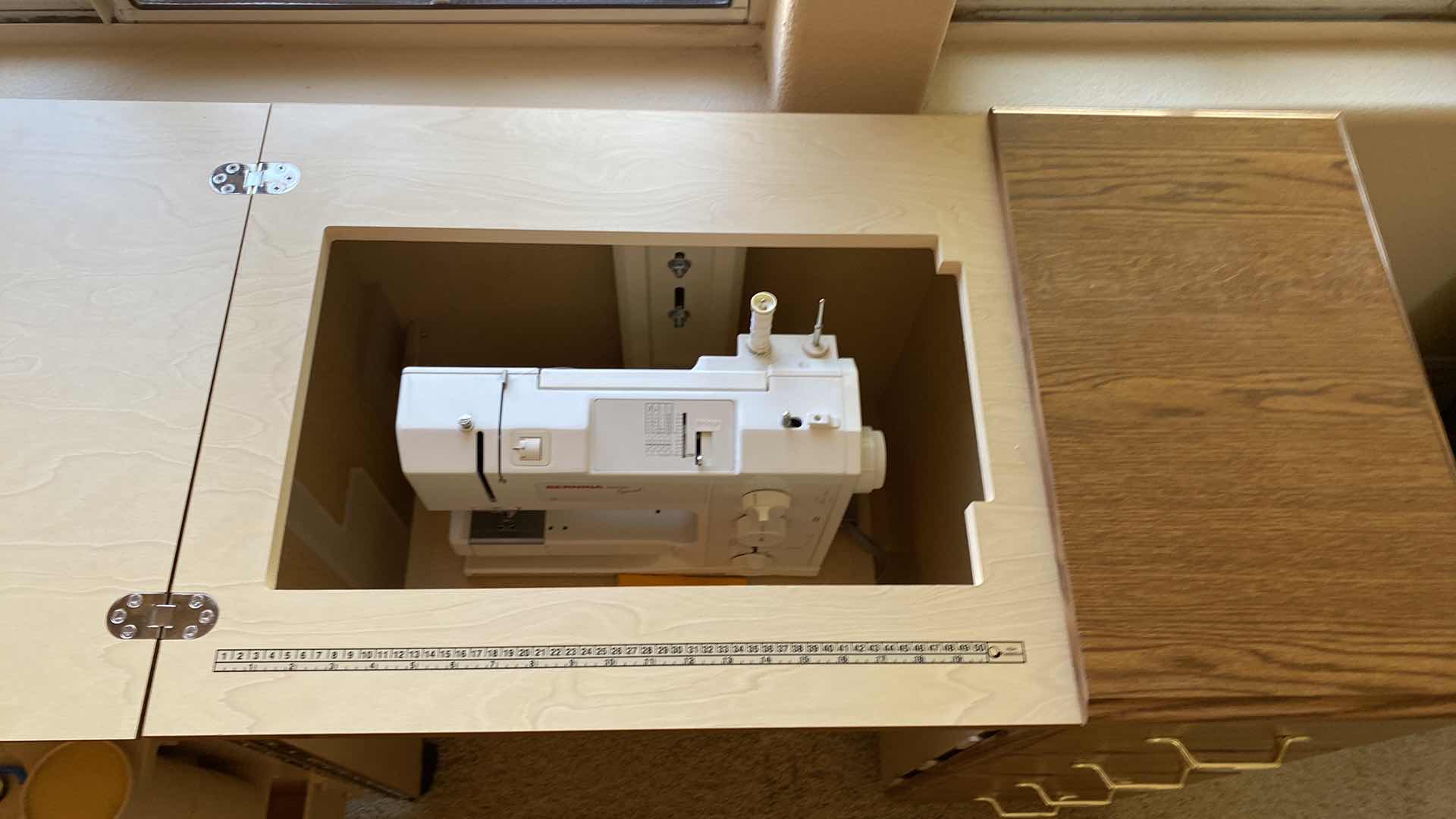 Photo 1 of BERNINA 1000 sewing machine in built in cabinet with storage