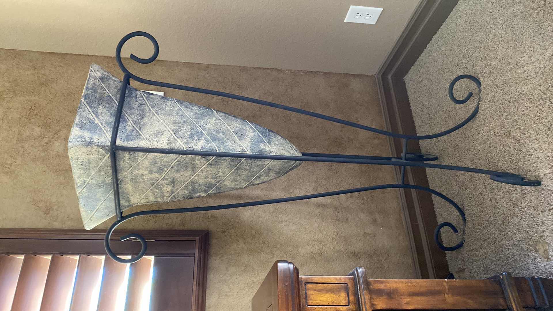 Photo 1 of LARGE POTTERY VASE IN WROUGHT IRON STAND 27” x 47”