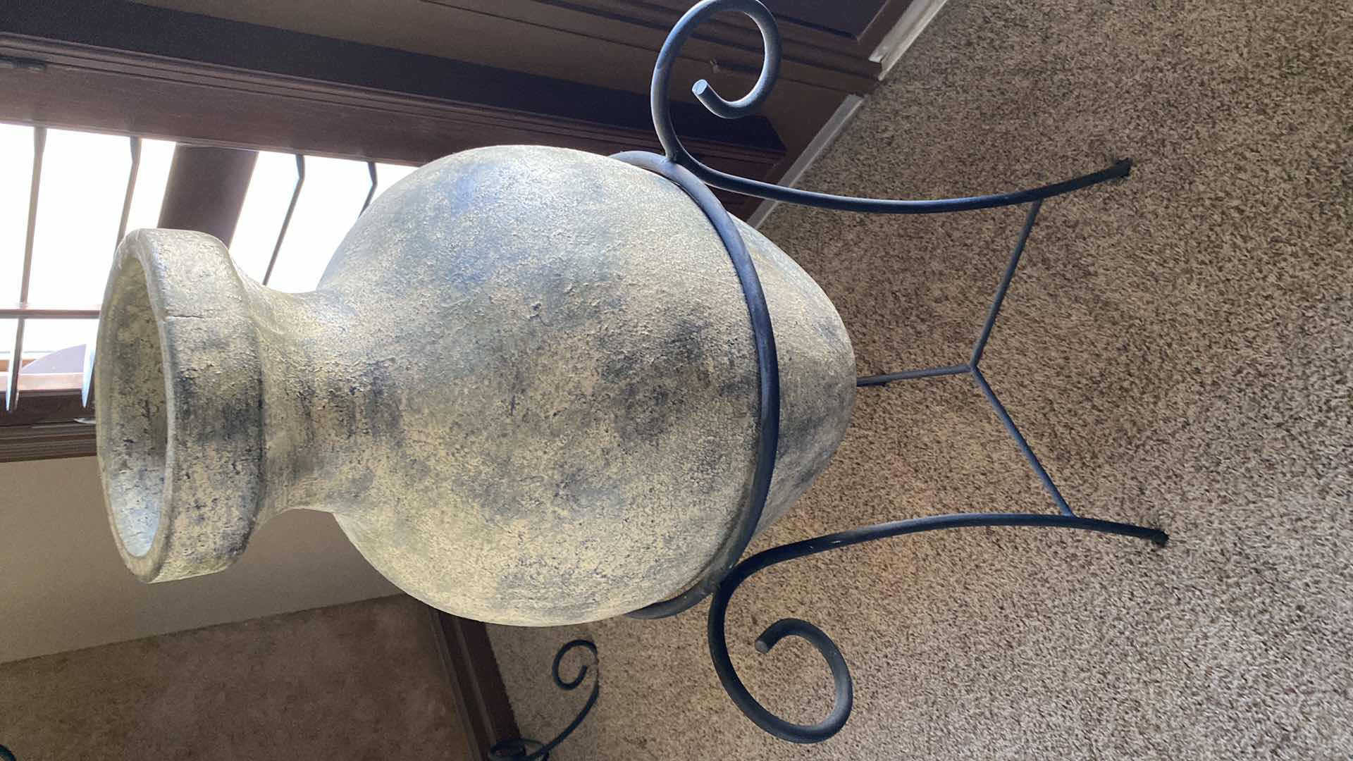 Photo 1 of LARGE POTTERY VASE IN WROUGHT IRON STAND 24“ x 42“
